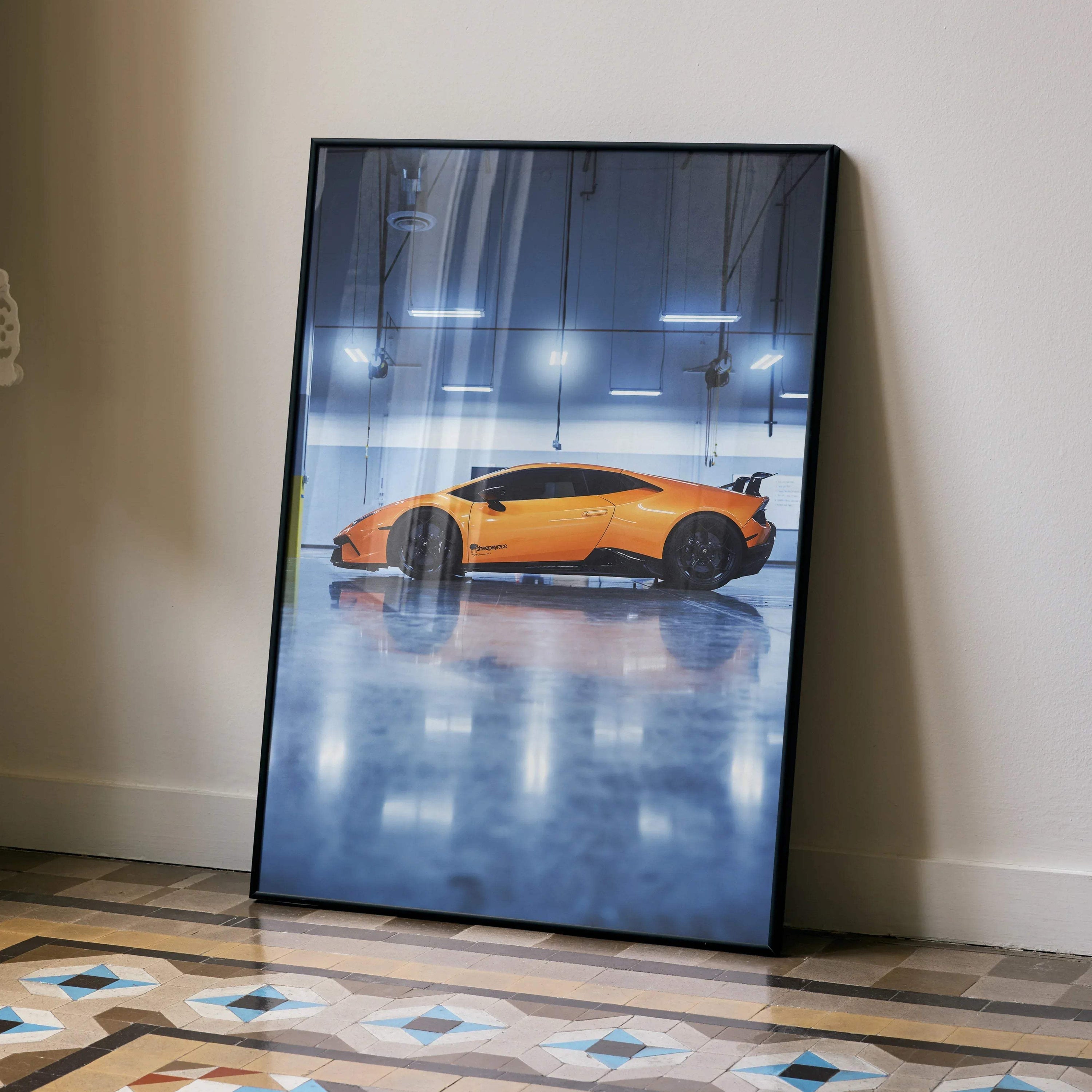 Lamborghini Huracan in vibrant orange reflected on glossy floor poster wall art with sleek black frame.