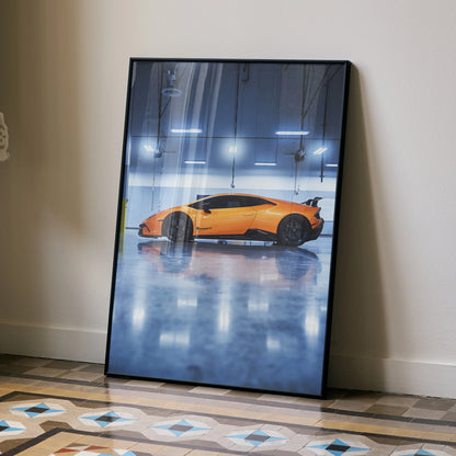Lamborghini Huracan in vibrant orange reflected on glossy floor poster wall art with sleek black frame.