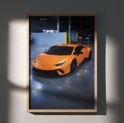 Lamborghini Huracan orange sports car poster wall art with sleek design in a wooden frame.