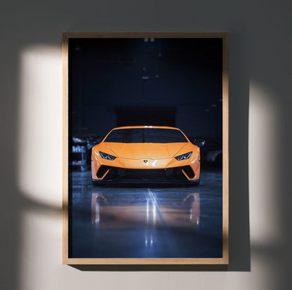Lamborghini Huracan in bright orange with sleek headlights on dark reflective floor poster wall art.