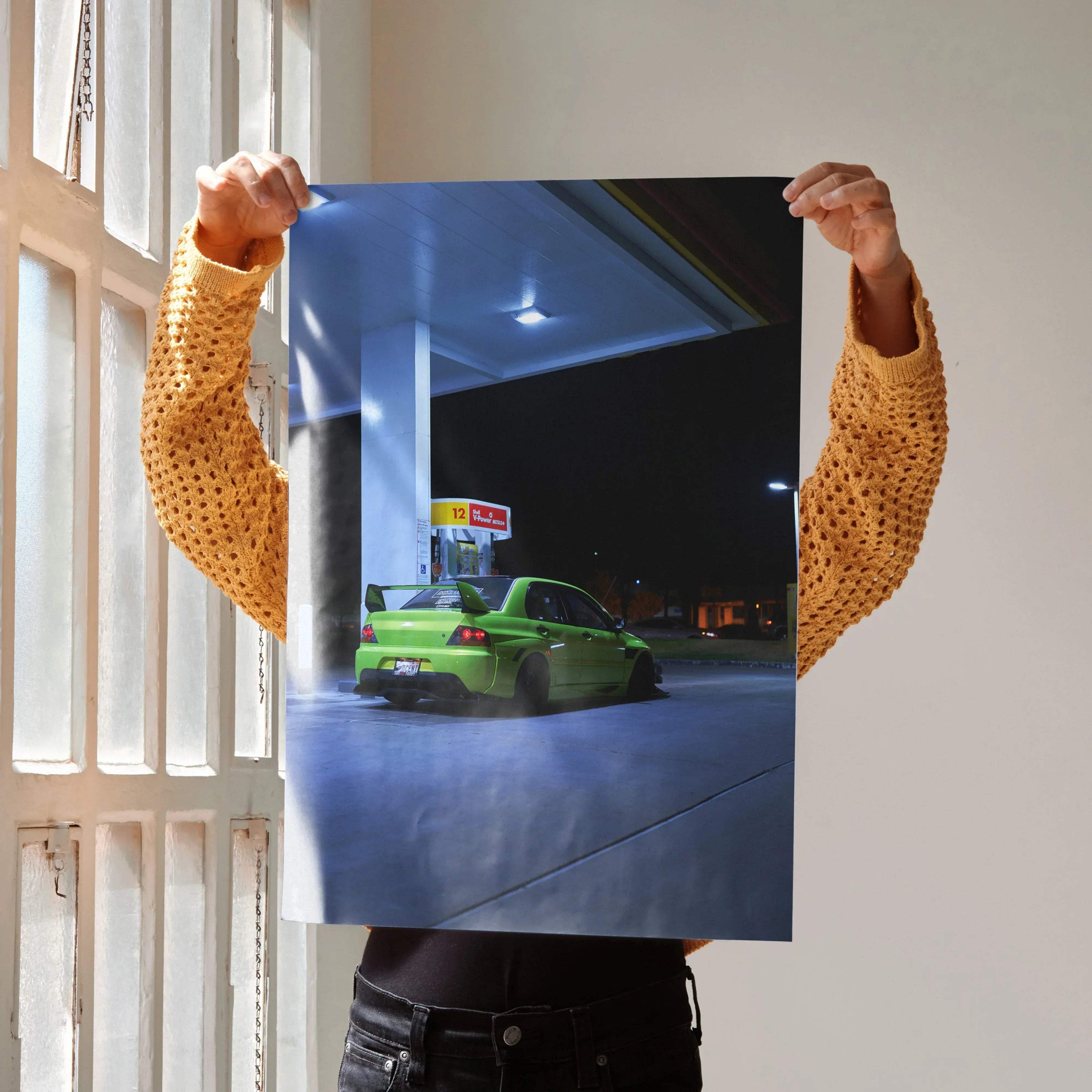Mitsubishi Evo 9 in bright green at gas station at night poster wall art.