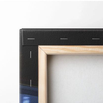 Close-up of black stretched canvas corner with wooden frame edge for vertical canvas art wall decor.