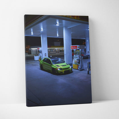 Mitsubishi Evo 9 in green parked at gas station at night vertical canvas wall art.