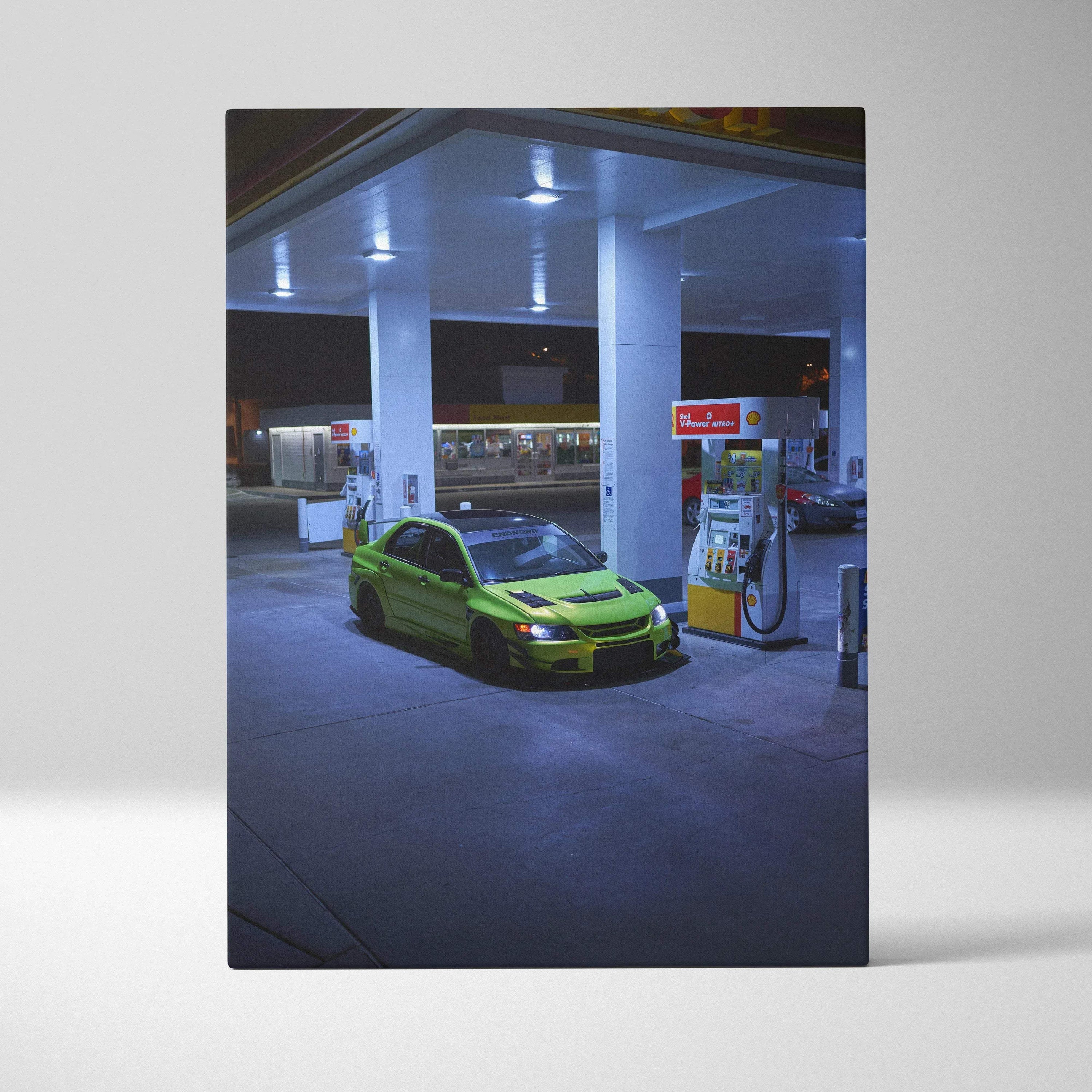 Mitsubishi Evo 9 in green under gas station lights canvas wall art print.