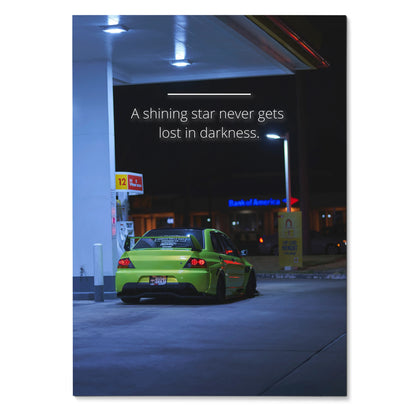 Motivational poster wall art featuring a green Mitsubishi Evo 9 under gas station lights with inspiring text.