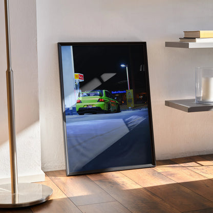 Mitsubishi Evo 9 in bright green nighttime street scene poster wall art in black frame.
