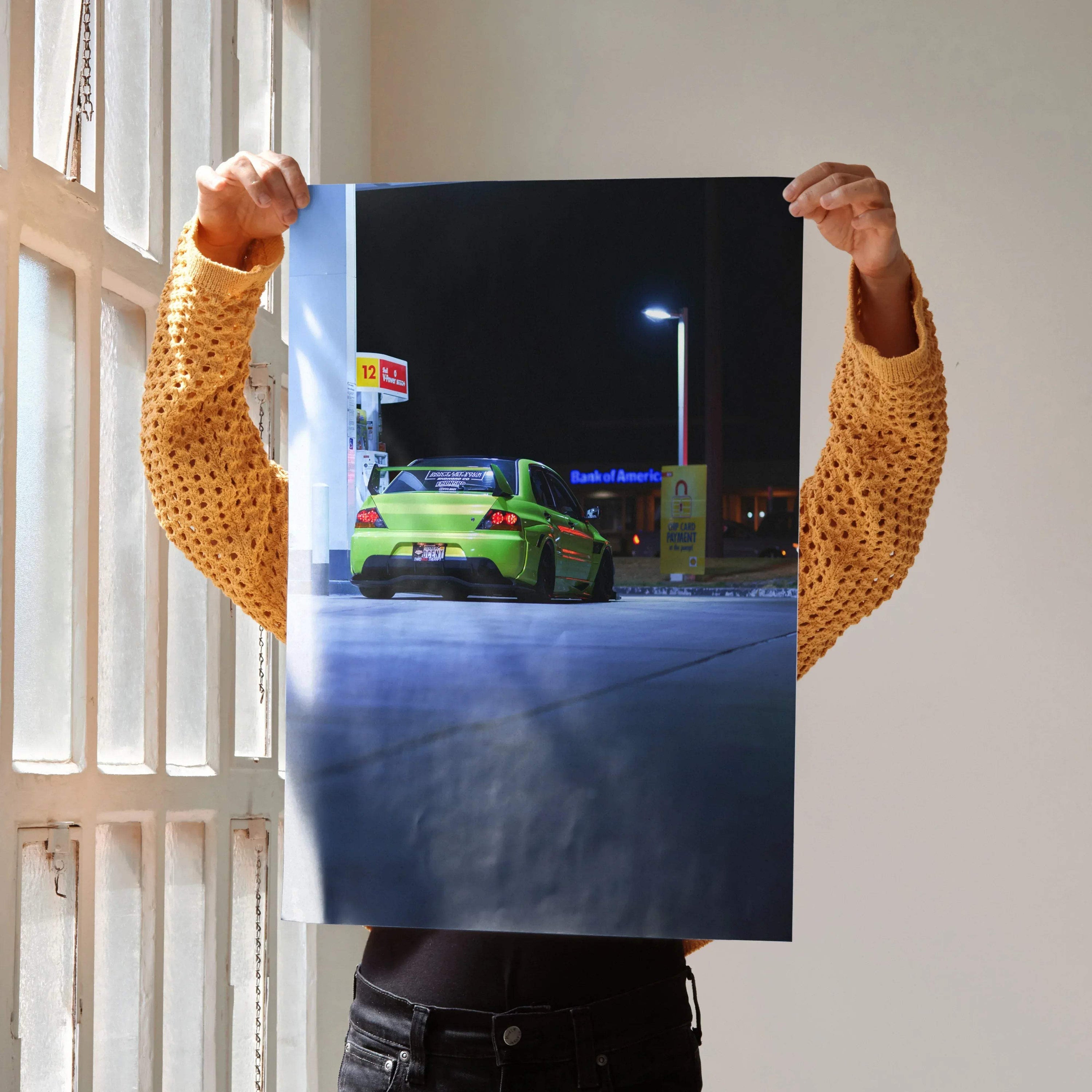 Mitsubishi Evo 9 in vibrant green parked at night, dynamic automotive poster wall art.