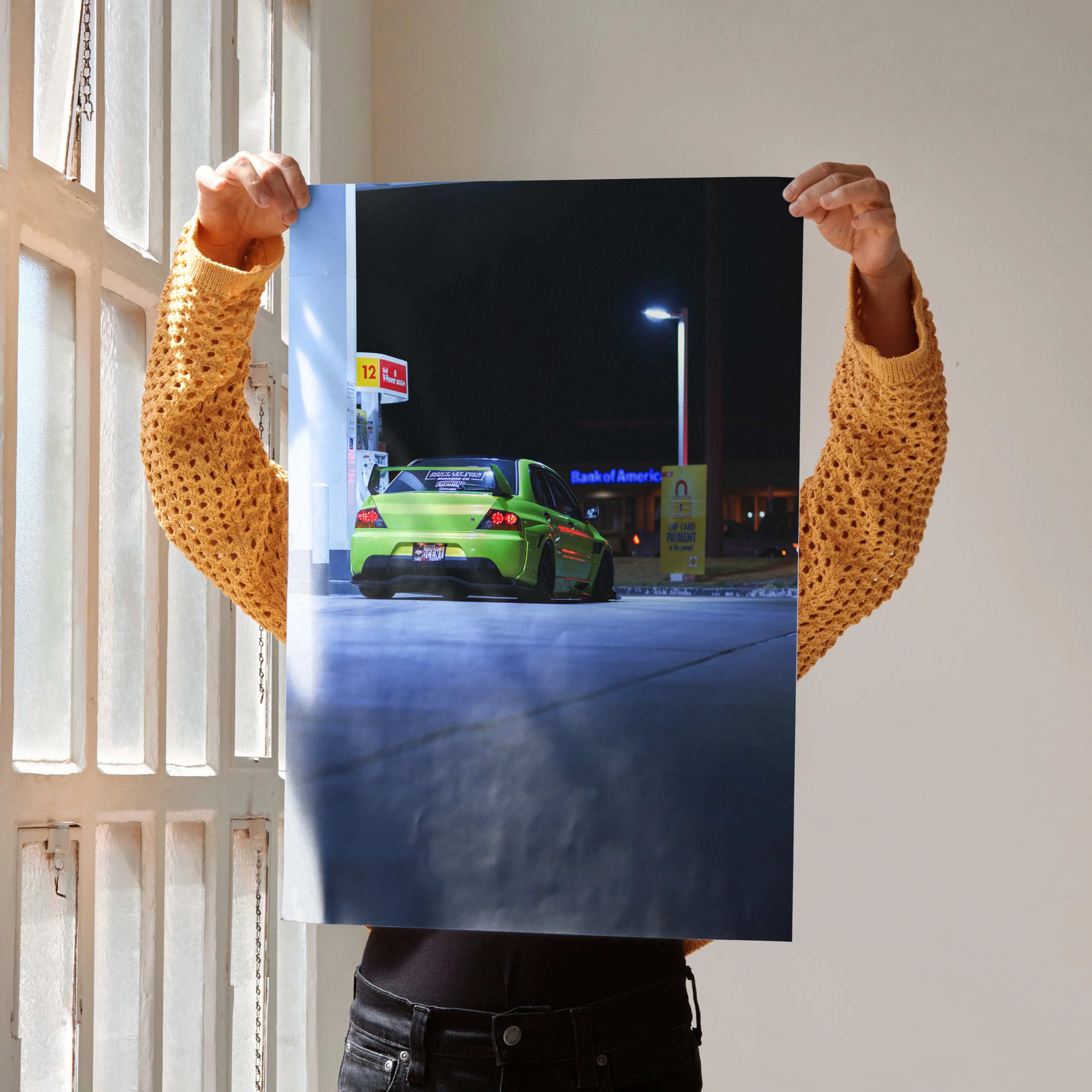 Mitsubishi Evo 9 in vibrant green parked at night, dynamic automotive poster wall art.