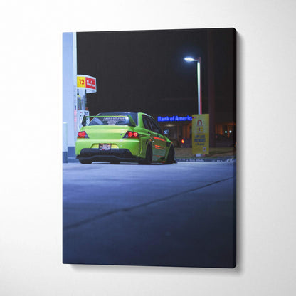 Vertical canvas art of a lime green Mitsubishi Evo 9 in a dark urban setting, wall art print.