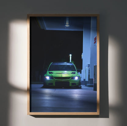 Mitsubishi Evo 9 glowing headlights poster wall art in dark urban setting with wooden frame.