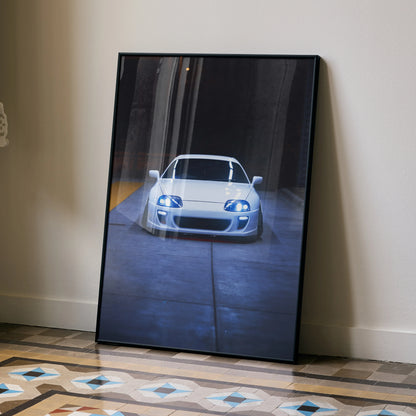 Toyota Supra MK4 front view poster leaning against wall in sleek black frame, automotive wall art.