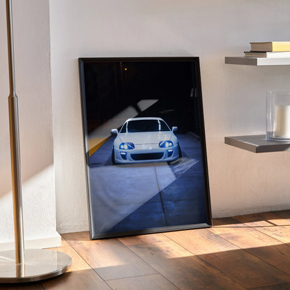 Toyota Supra MK4 front view poster wall art with dark background and sleek lighting effects.