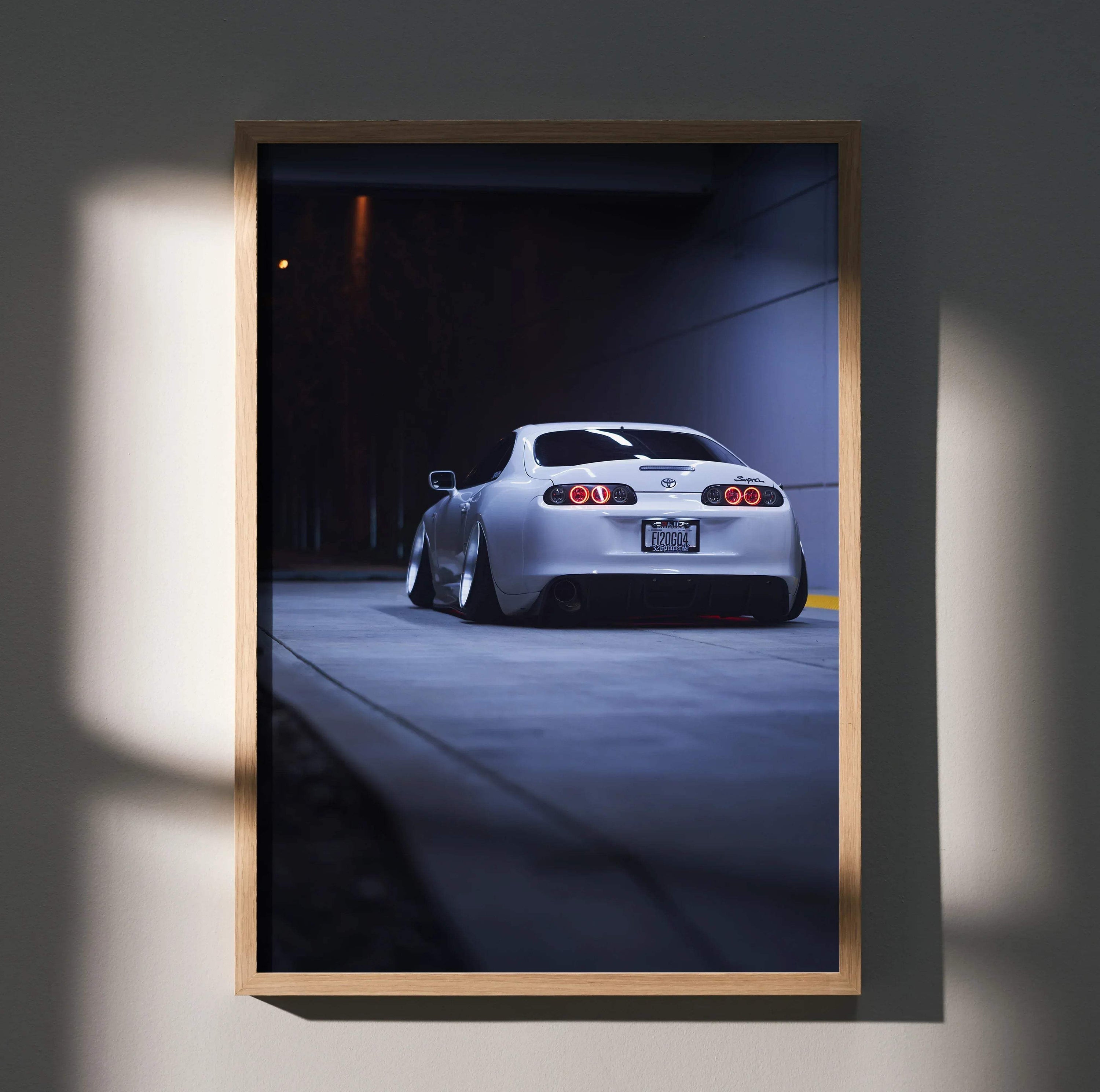 Toyota Supra MK4 rear view poster, sleek white car in dimly lit urban setting wall art.