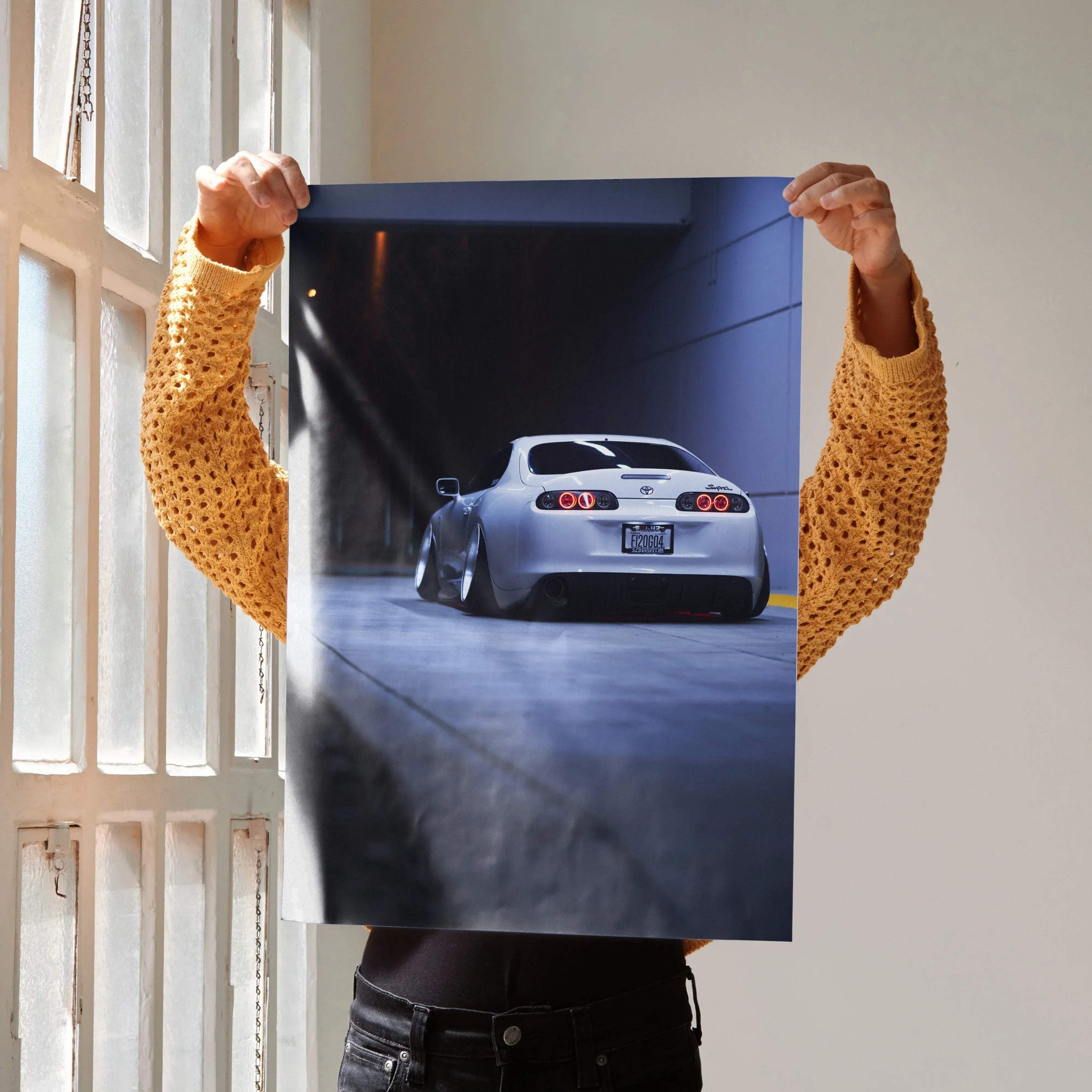 Toyota Supra MK4 rear view poster with dark, dramatic lighting, premium wall art print.