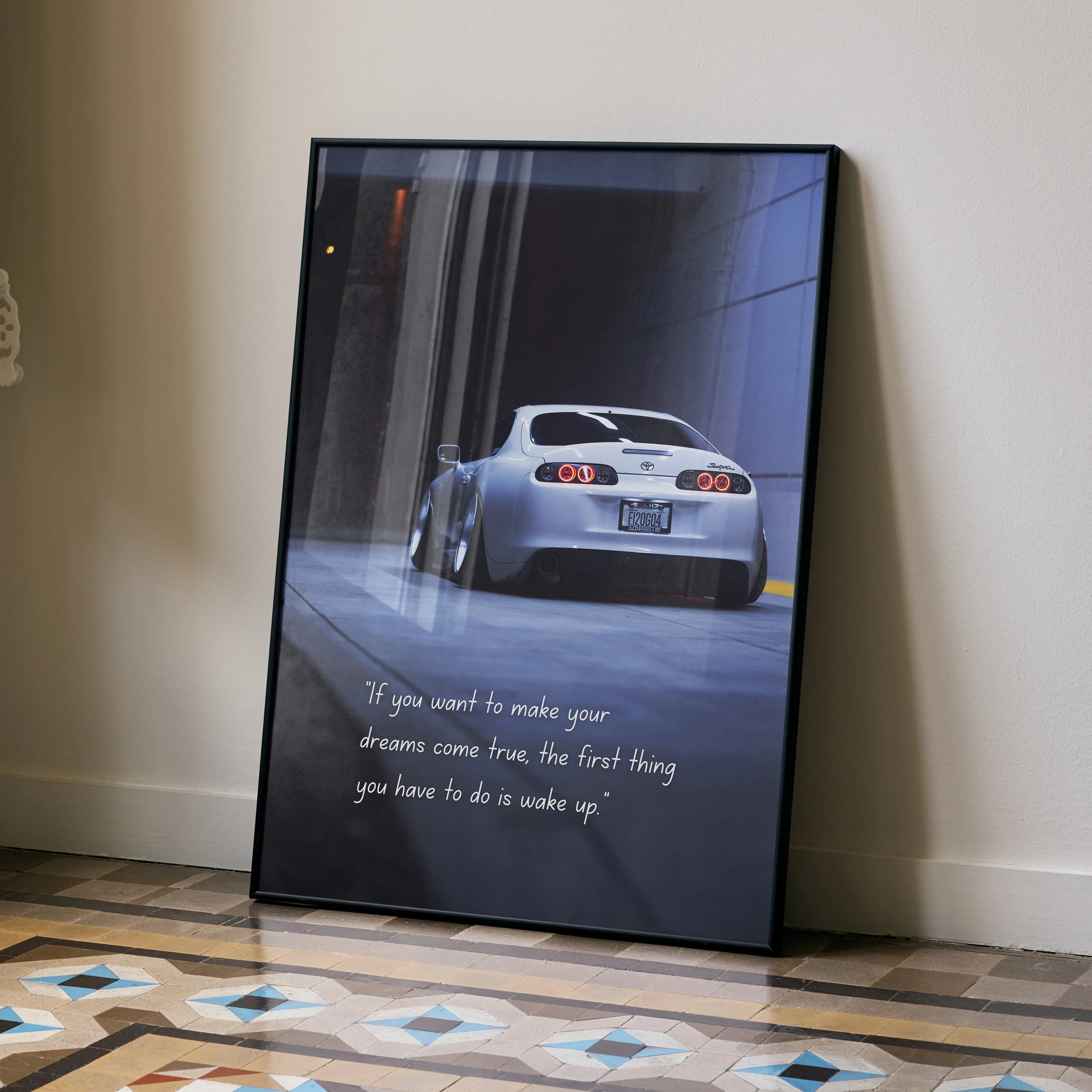 Toyota Supra Mk4 rear view motivational poster wall art with inspiring quote in black frame.