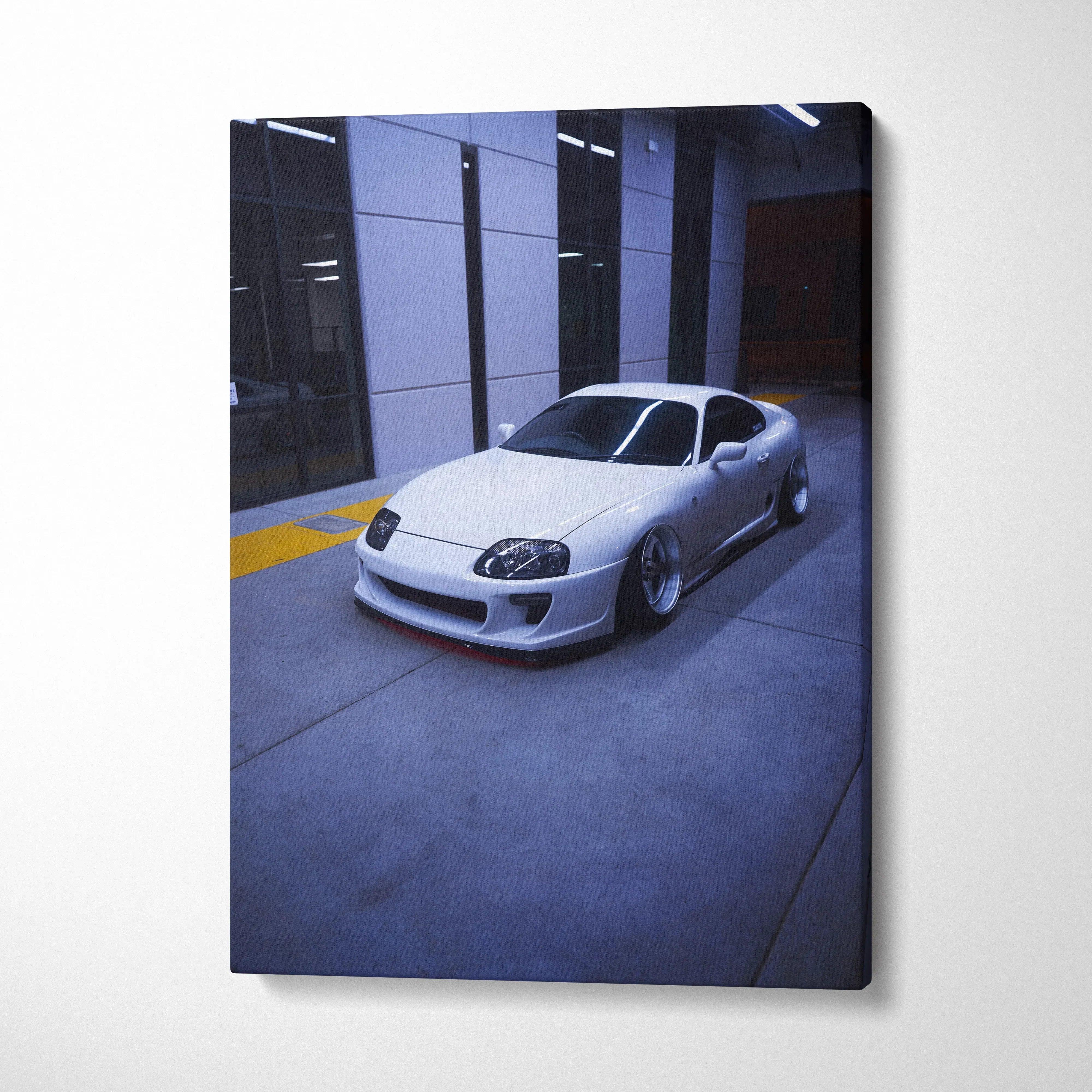 Toyota Supra MK4 sleek silver sports car canvas art wall decor in modern garage setting.