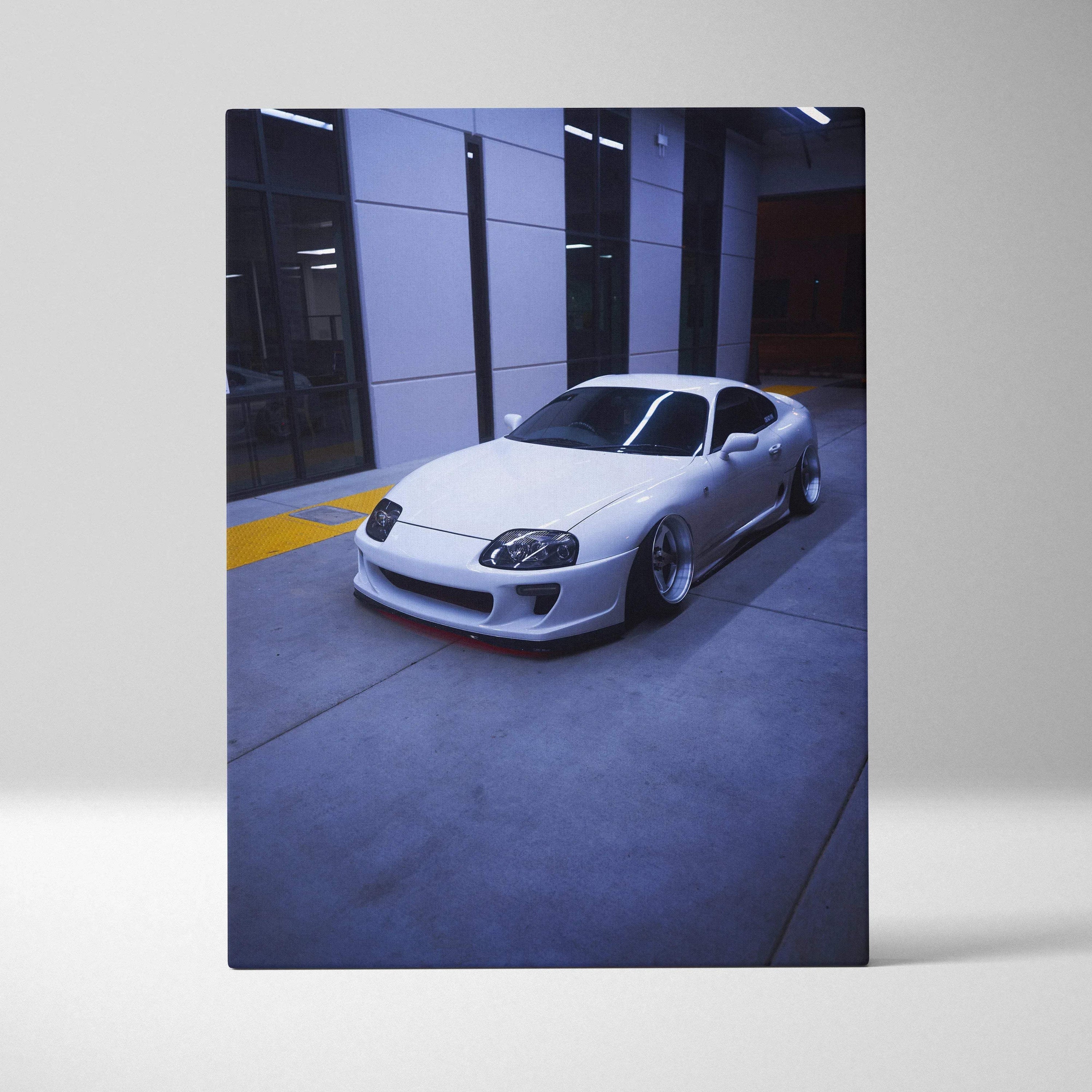 Toyota Supra MK4 sleek silver sports car canvas art wall decor in urban setting.