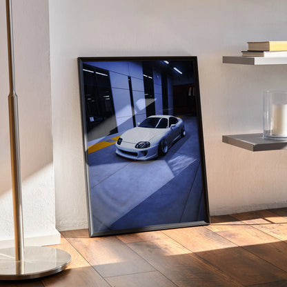 Toyota Supra MK4 white car poster with dark garage background wall art in black frame.