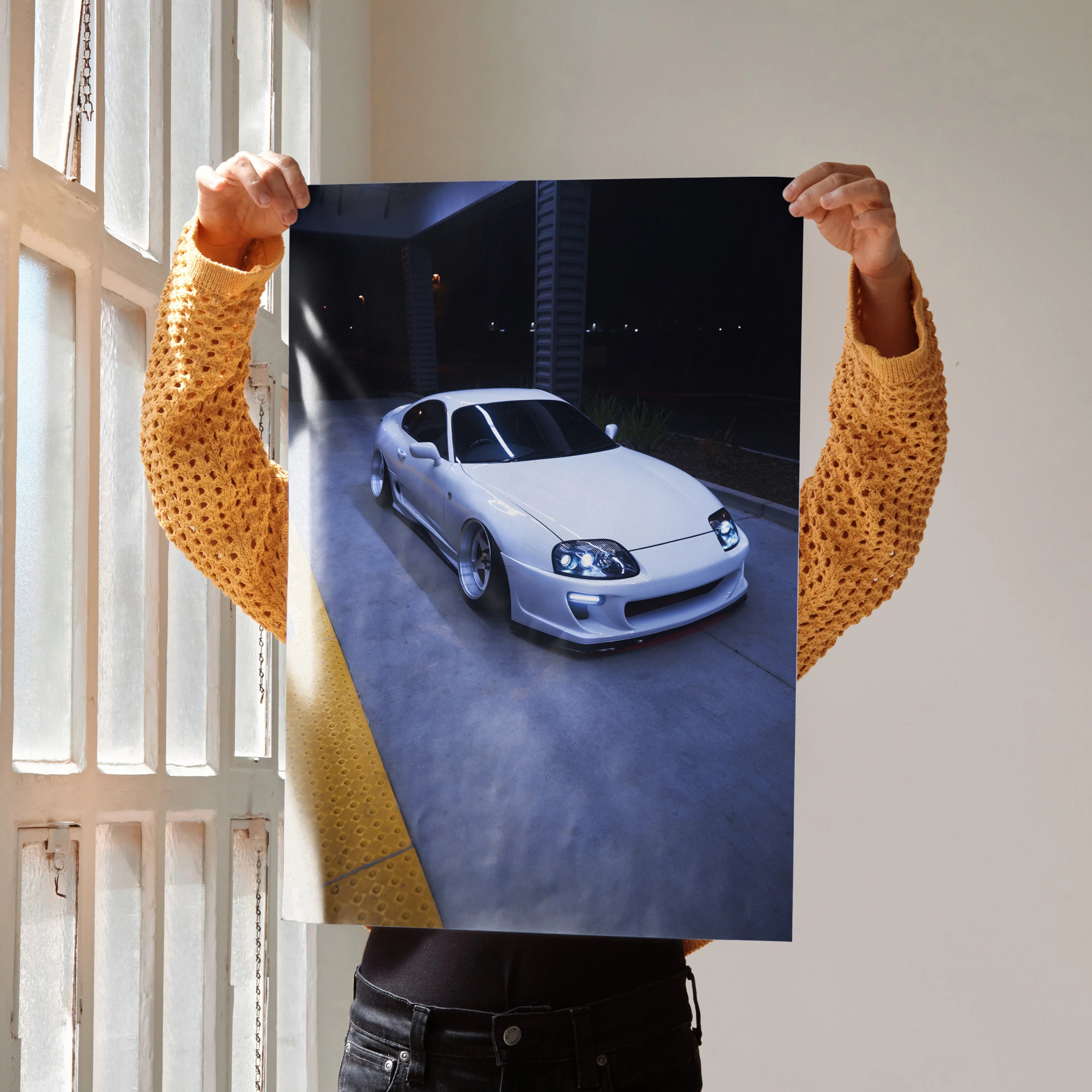 Toyota Supra MK4 in white parked at night poster wall art with urban background.