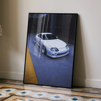 Toyota Supra MK4 white sports car poster leaning against beige wall, automotive wall art.
