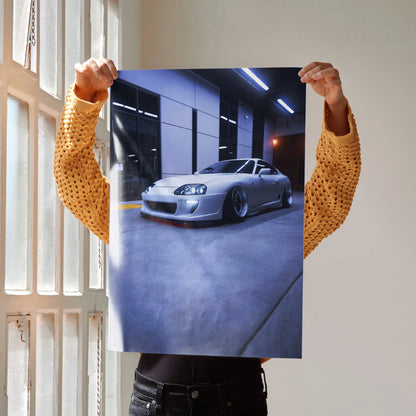 Toyota Supra MK4 poster showcasing a silver sports car in a modern garage, wall art decor.