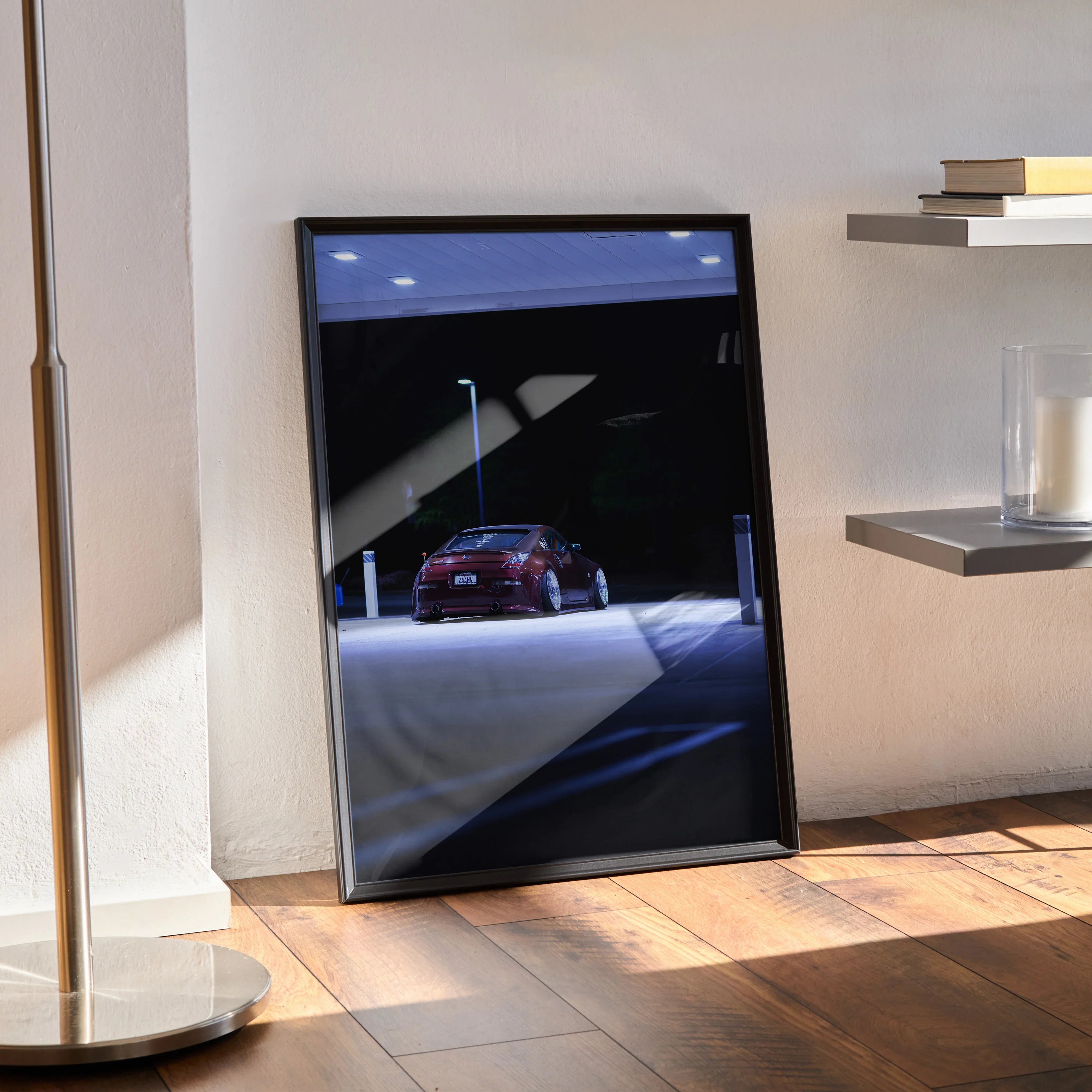 Nissan 350Z poster with red car under streetlights, modern high-resolution wall art in black frame.