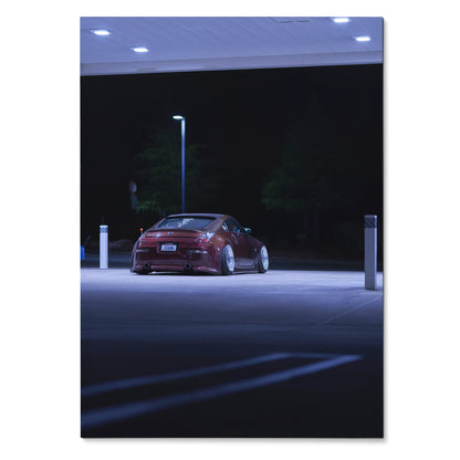 Nissan 350Z in dark red under streetlight at night, high-resolution poster wall art.