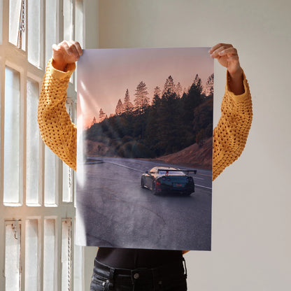 Nissan GTR R35 driving on scenic road at sunset poster wall art with forest background.