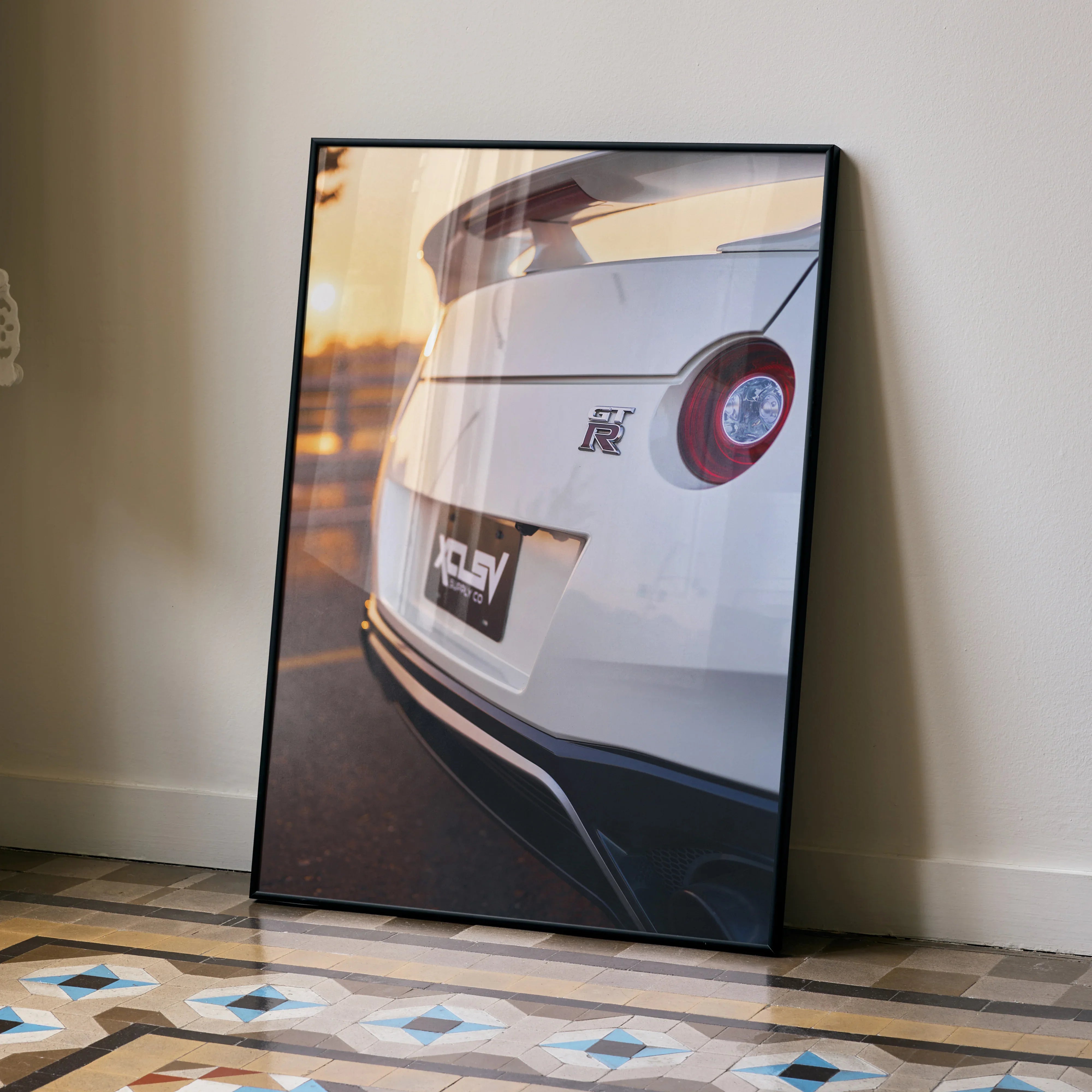 Nissan R35 GTR rear close-up poster with sunset reflection, high-resolution wall art in black frame.