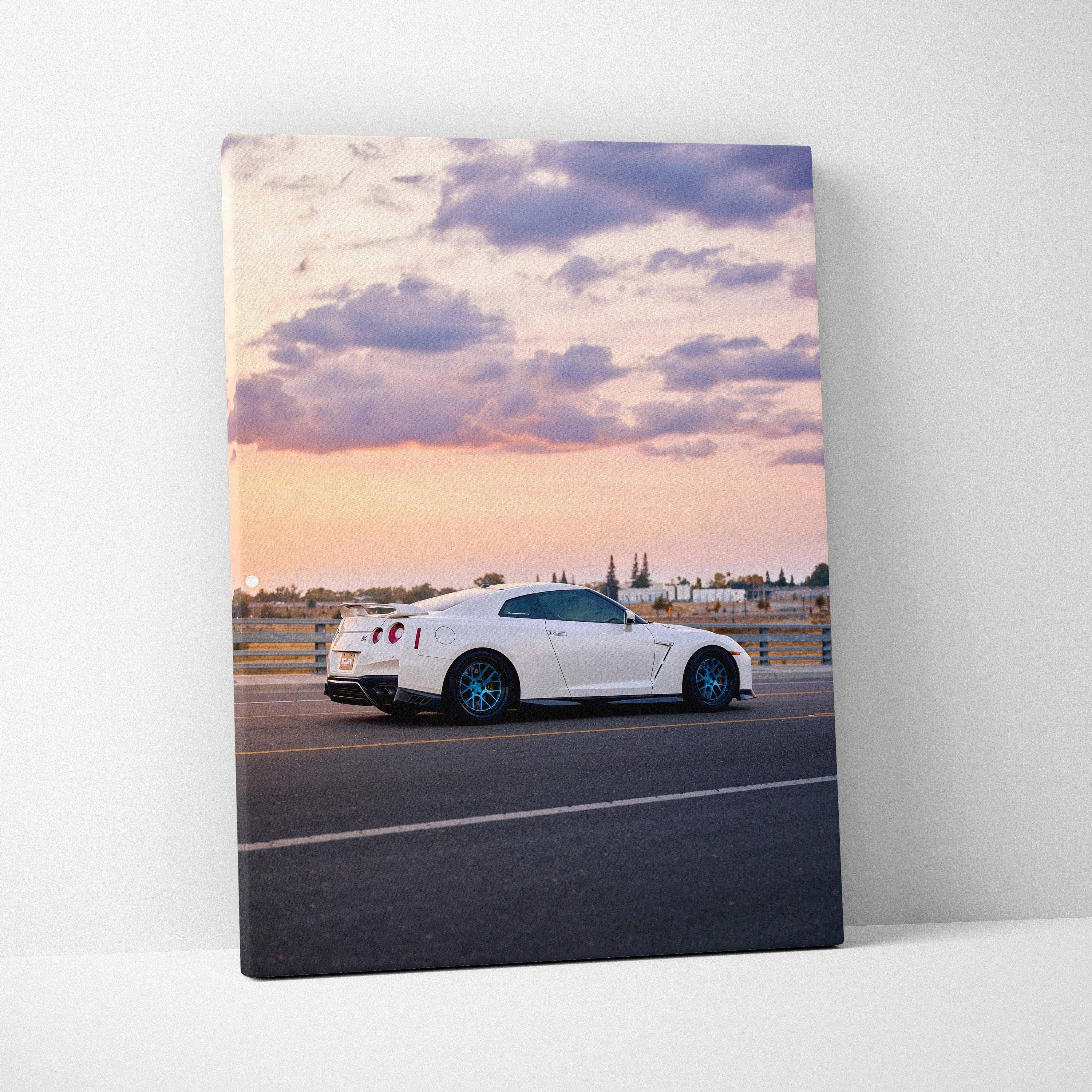 White Nissan R35 GTR sports car on road at sunset canvas wall art vertical print.