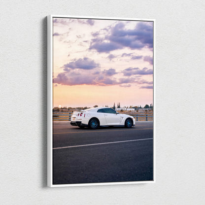 Nissan R35 GTR at sunset on vertical canvas wall art with cityscape background.
