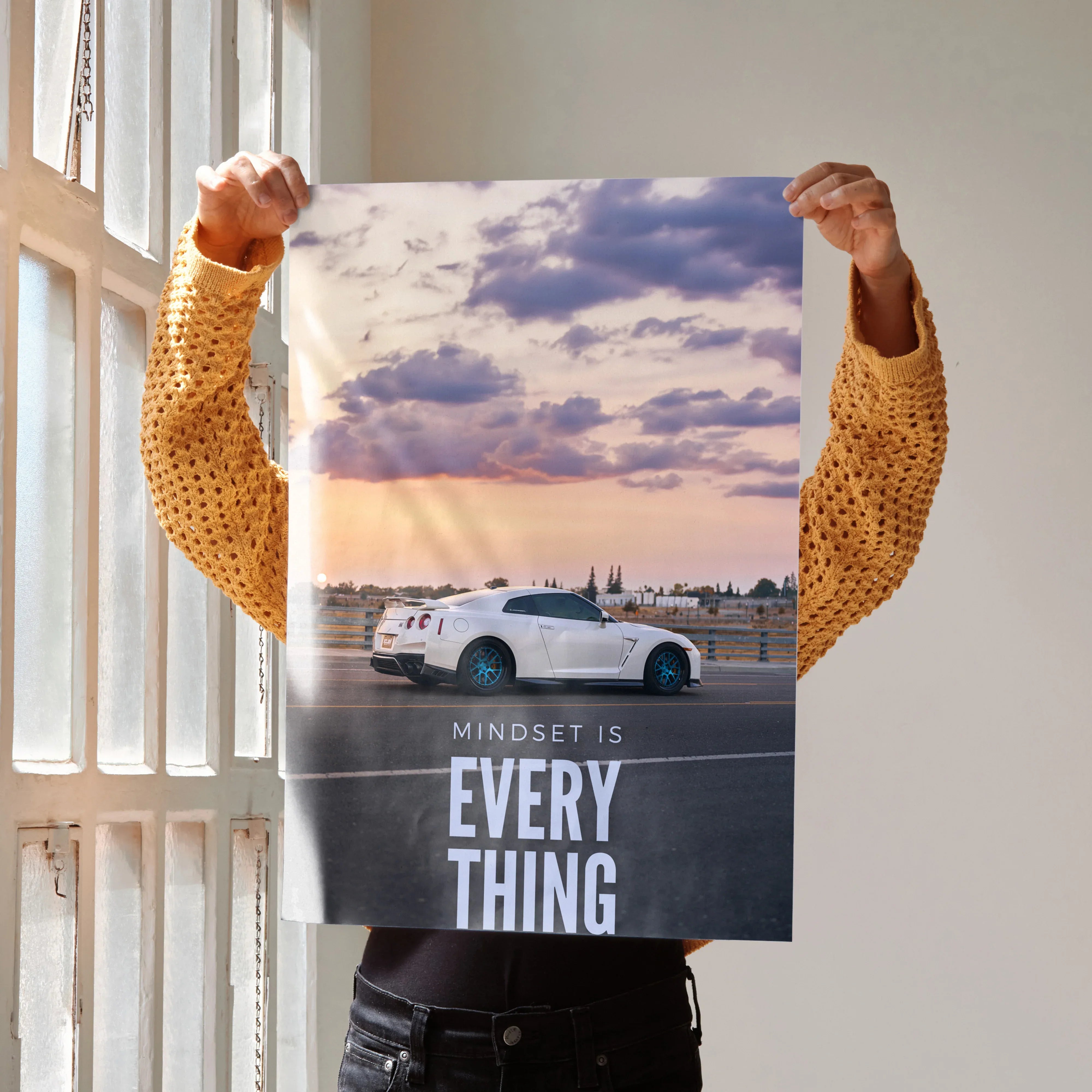 Motivational poster wall art featuring white Nissan R35 GT-R with sunset and inspiring text Mindset Is Everything.