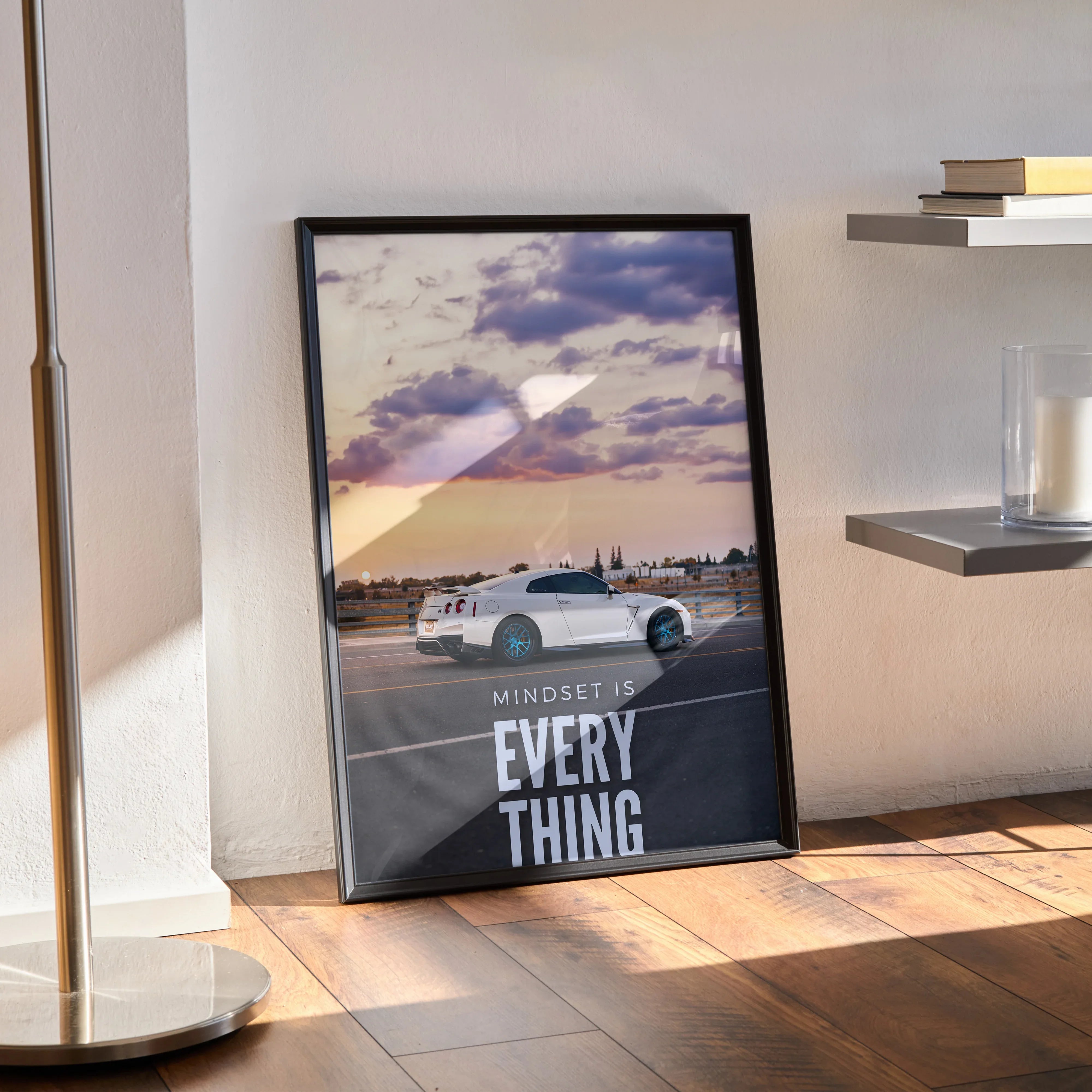 Nissan R35 GT-R poster with motivational text and sunset background wall art in black frame.