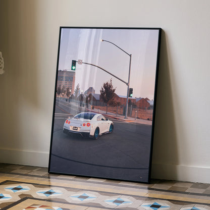Nissan GTR R35 white sports car poster leaning against wall with urban street background wall art.