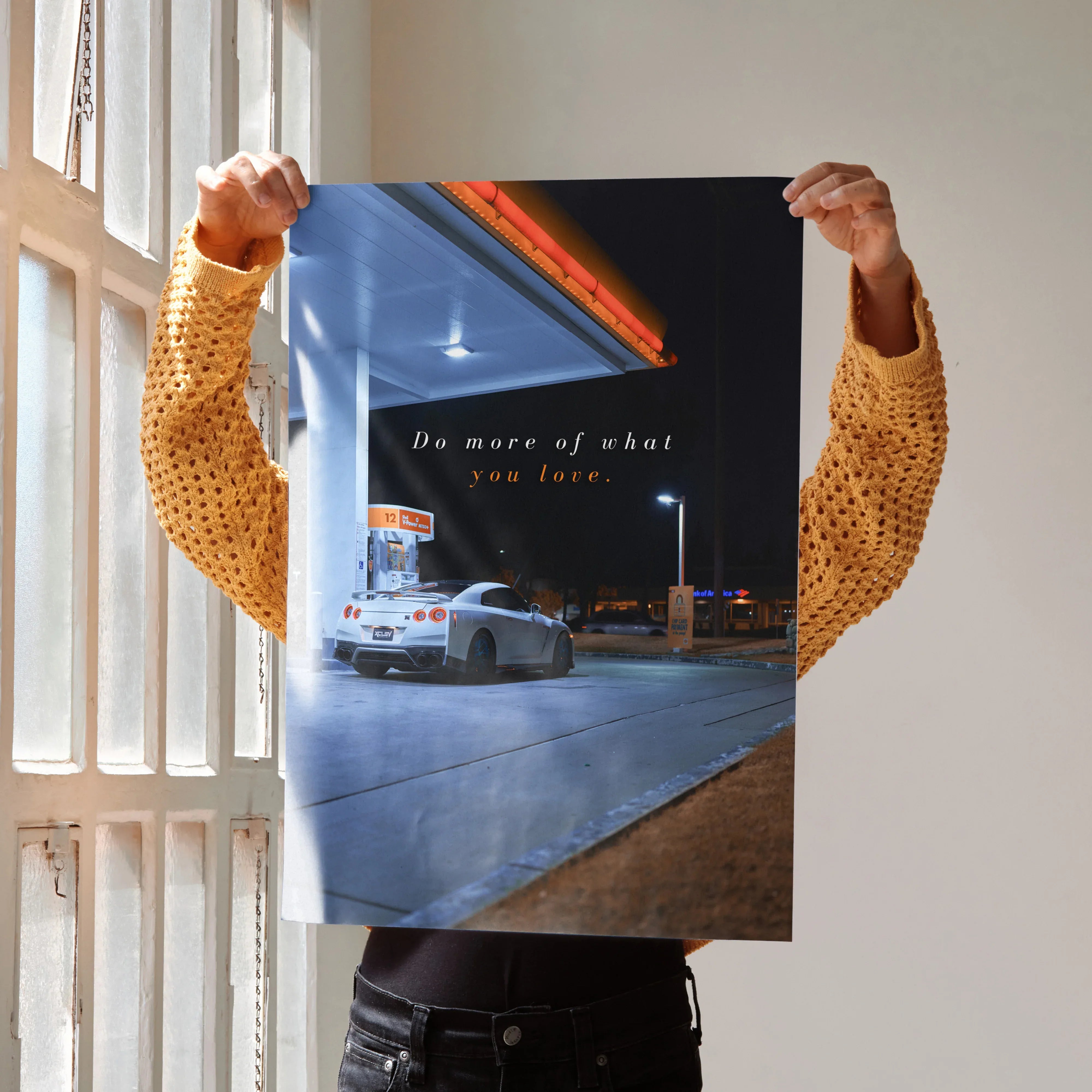 Poster wall art featuring a white Nissan R35 GT-R at a gas station with motivational text.