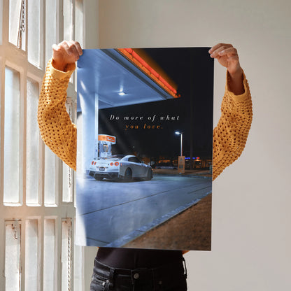 Poster wall art featuring a white Nissan R35 GT-R at a gas station with motivational text.
