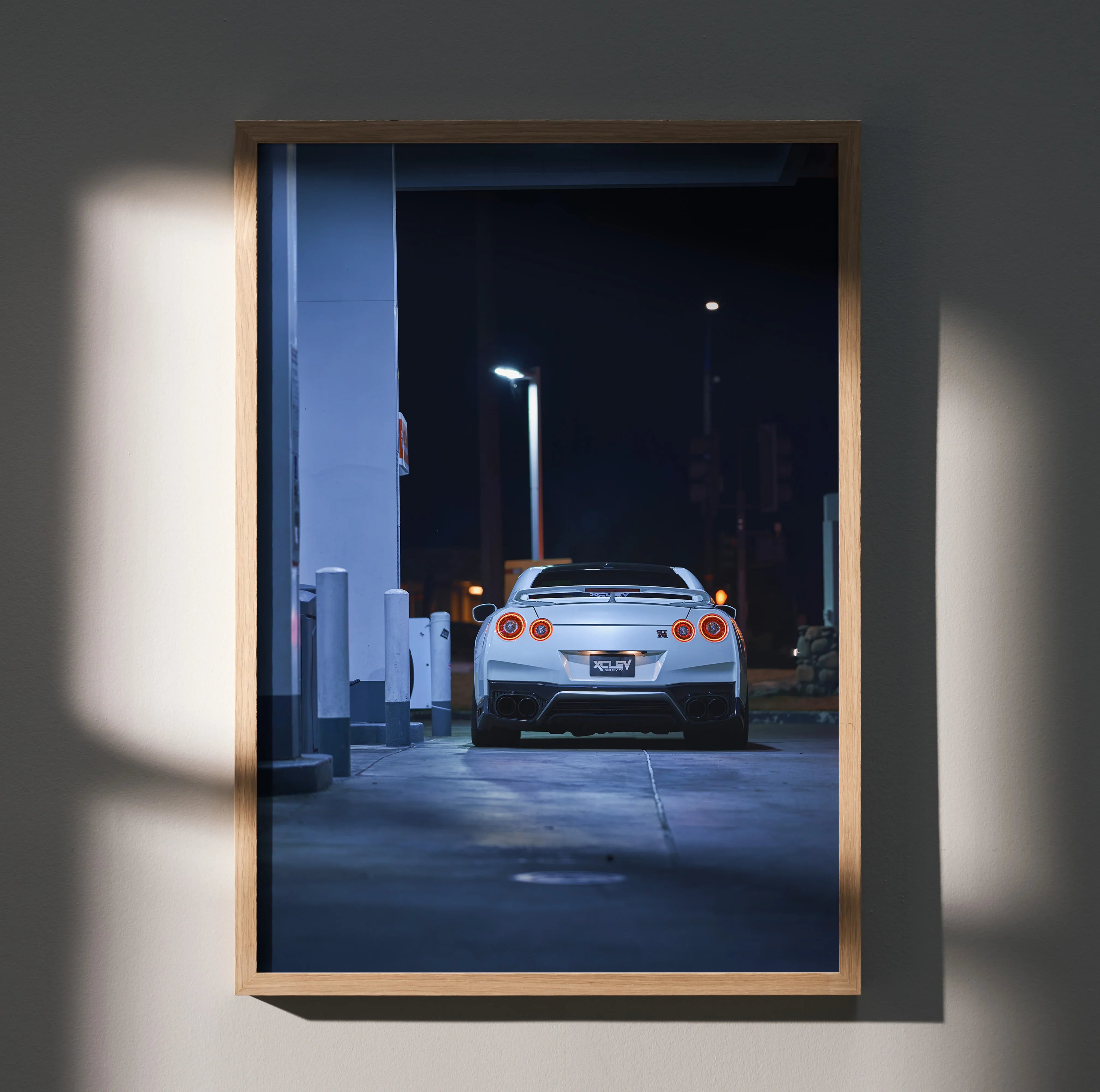 Nissan GTR R35 rear view at night poster wall art in wooden frame.