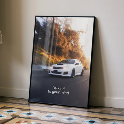 Motivational poster wall art featuring a white Subaru WRX STI on a winding road with inspiring text "Be kind to your mind".