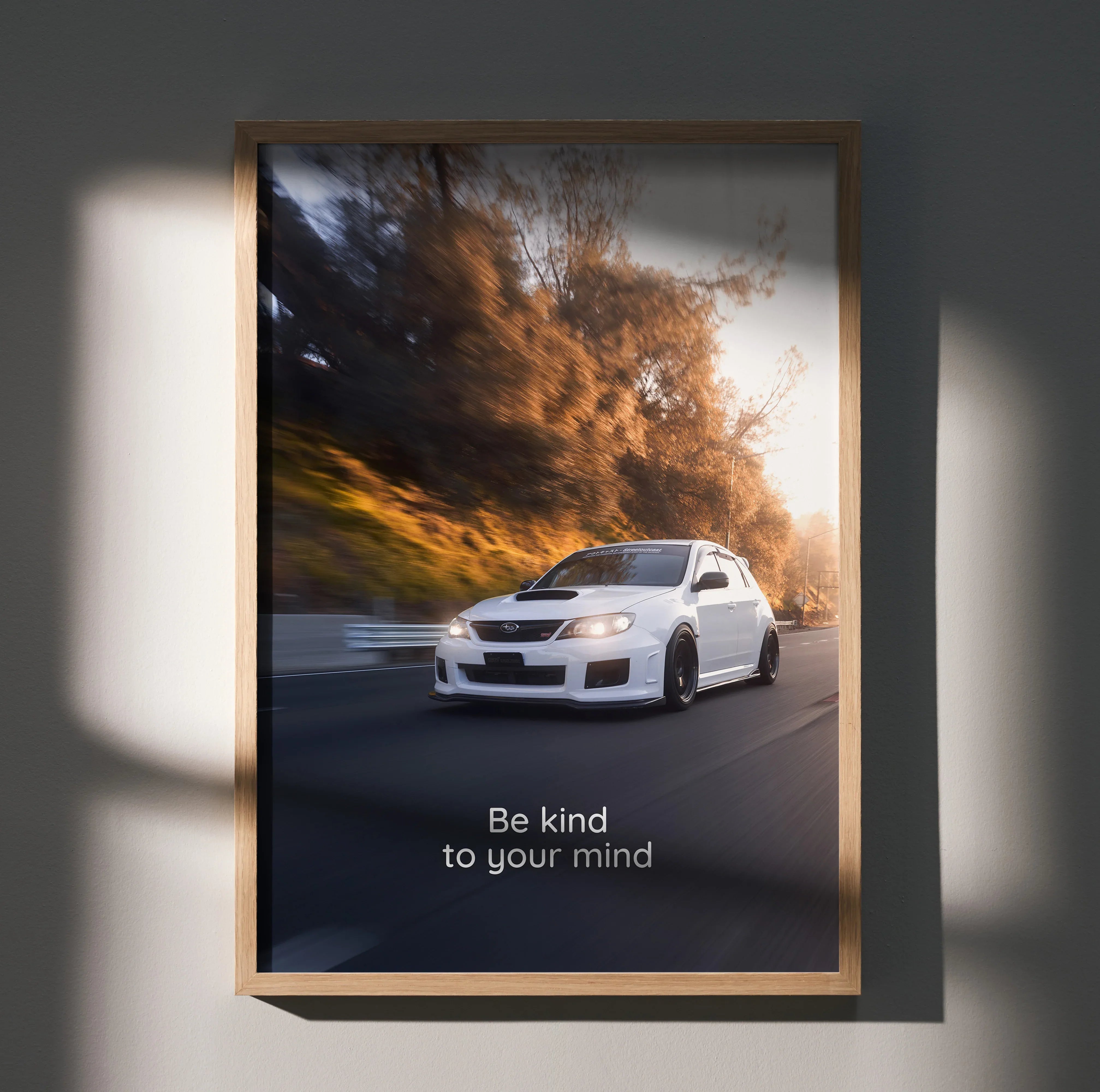 Subaru WRX STI poster wall art with white car driving at sunset and motivational text Be kind to your mind.