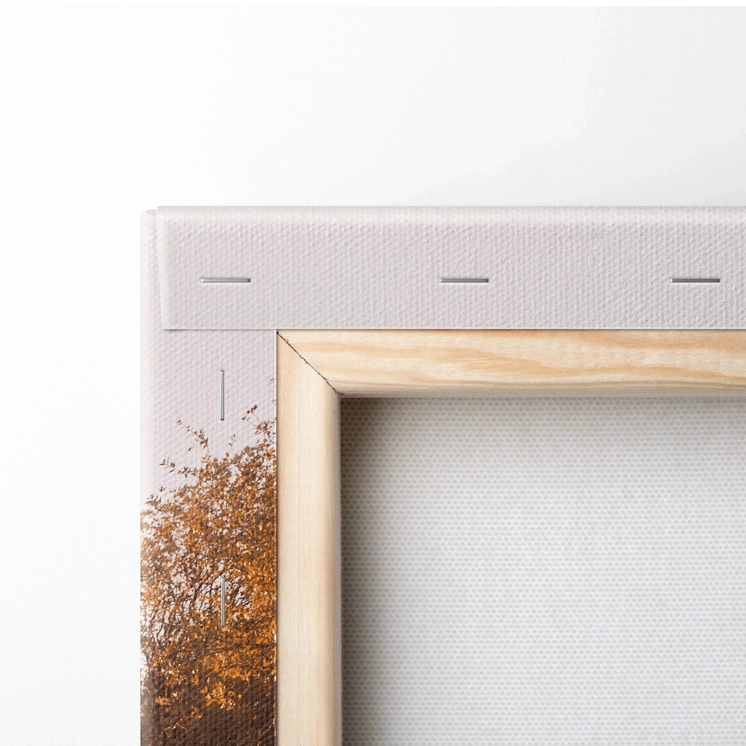 Close-up of wooden frame and stapled white canvas for vertical wall art print.