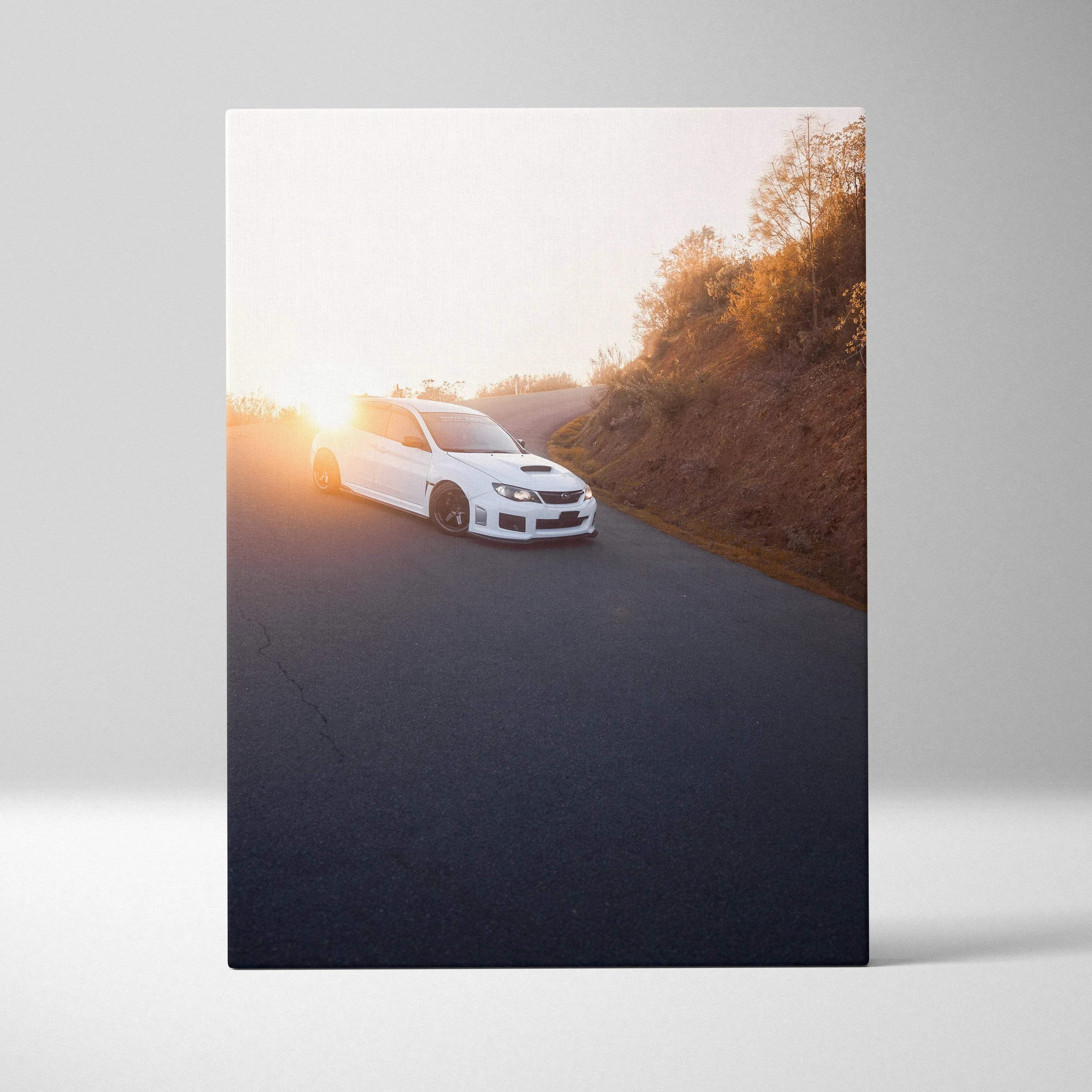 White Subaru WRX STI on road at sunset with golden trees Canvas wall art print.