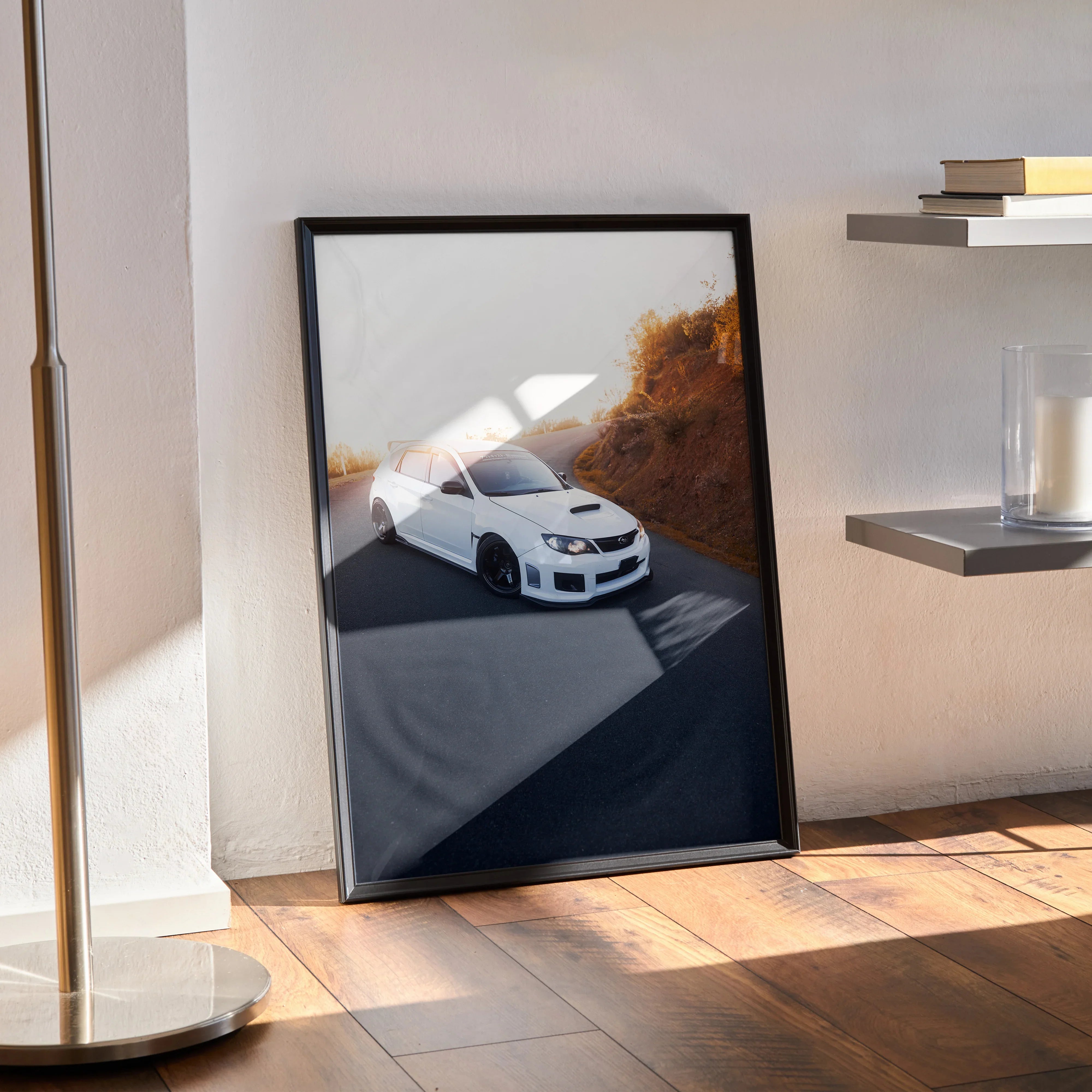 Subaru WRX STI poster featuring white car on mountain road, high-quality wall art in black frame.