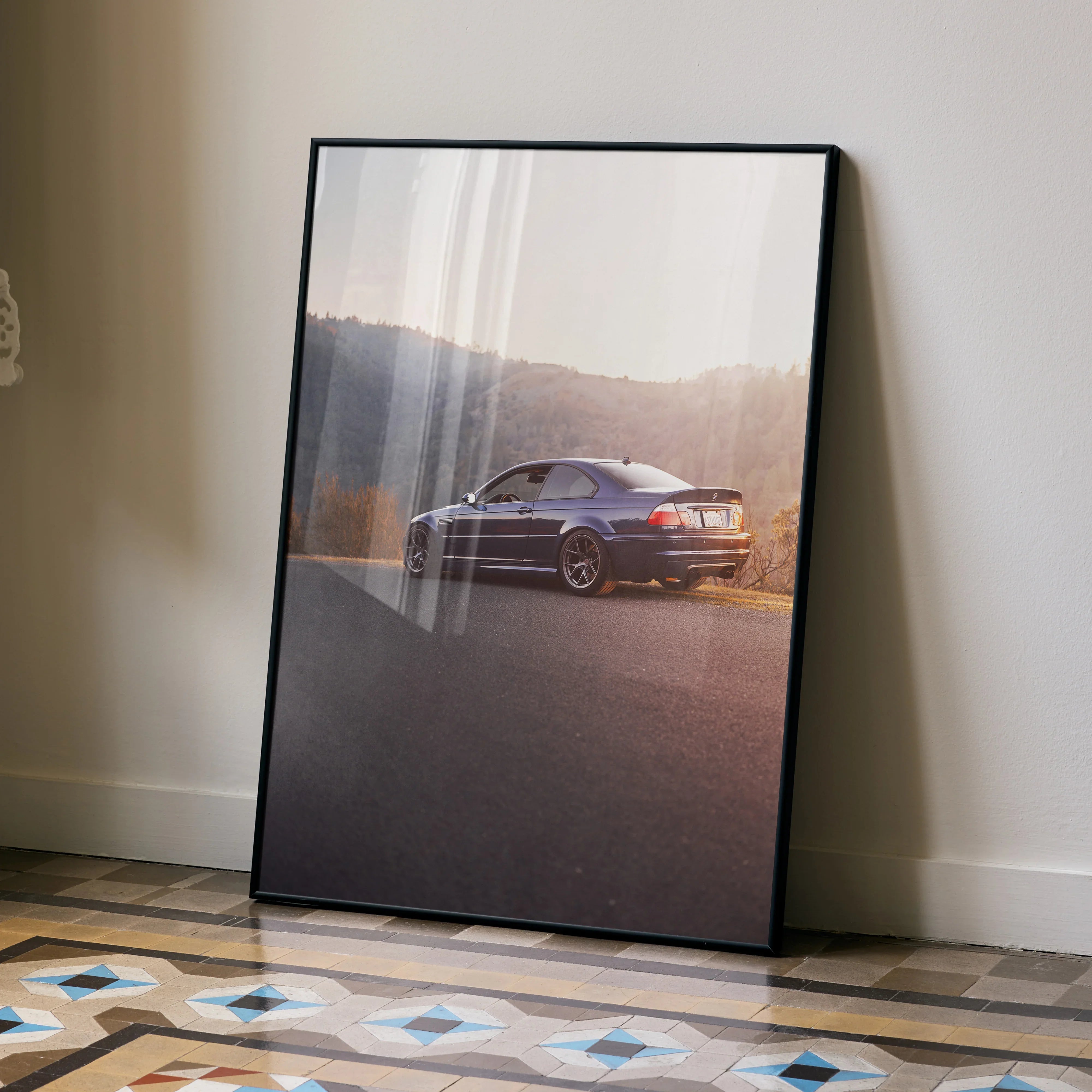 BMW E46 M3 parked on road at sunset high resolution poster wall art in black frame.