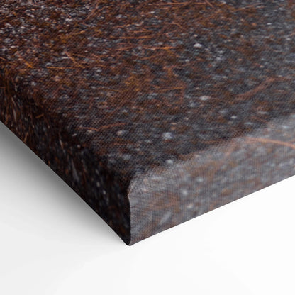 Close-up of textured dark-toned canvas print edge showcasing high-quality wall art material.