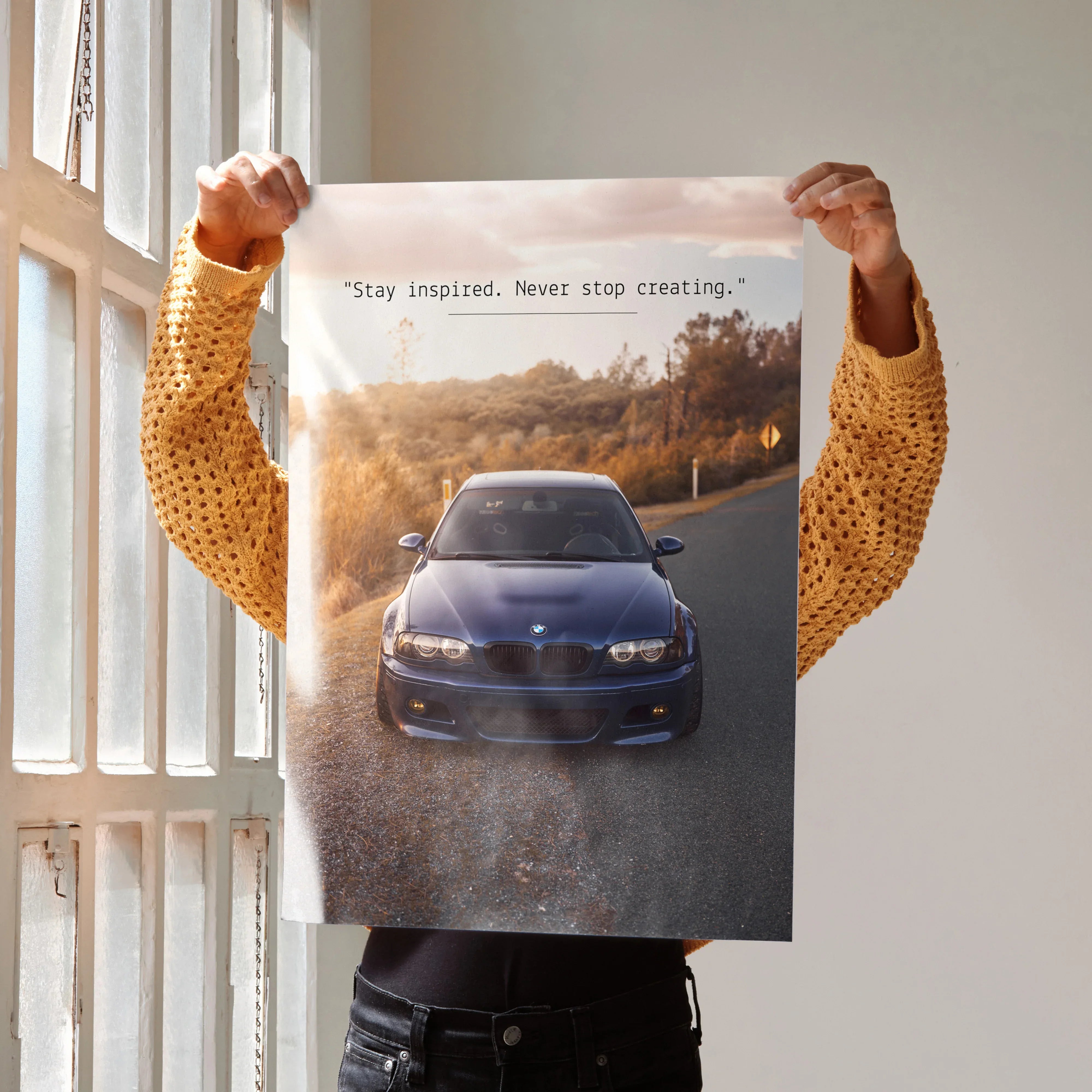 Motivational poster wall art featuring BMW E46 M3 on sunset road with inspiring text.