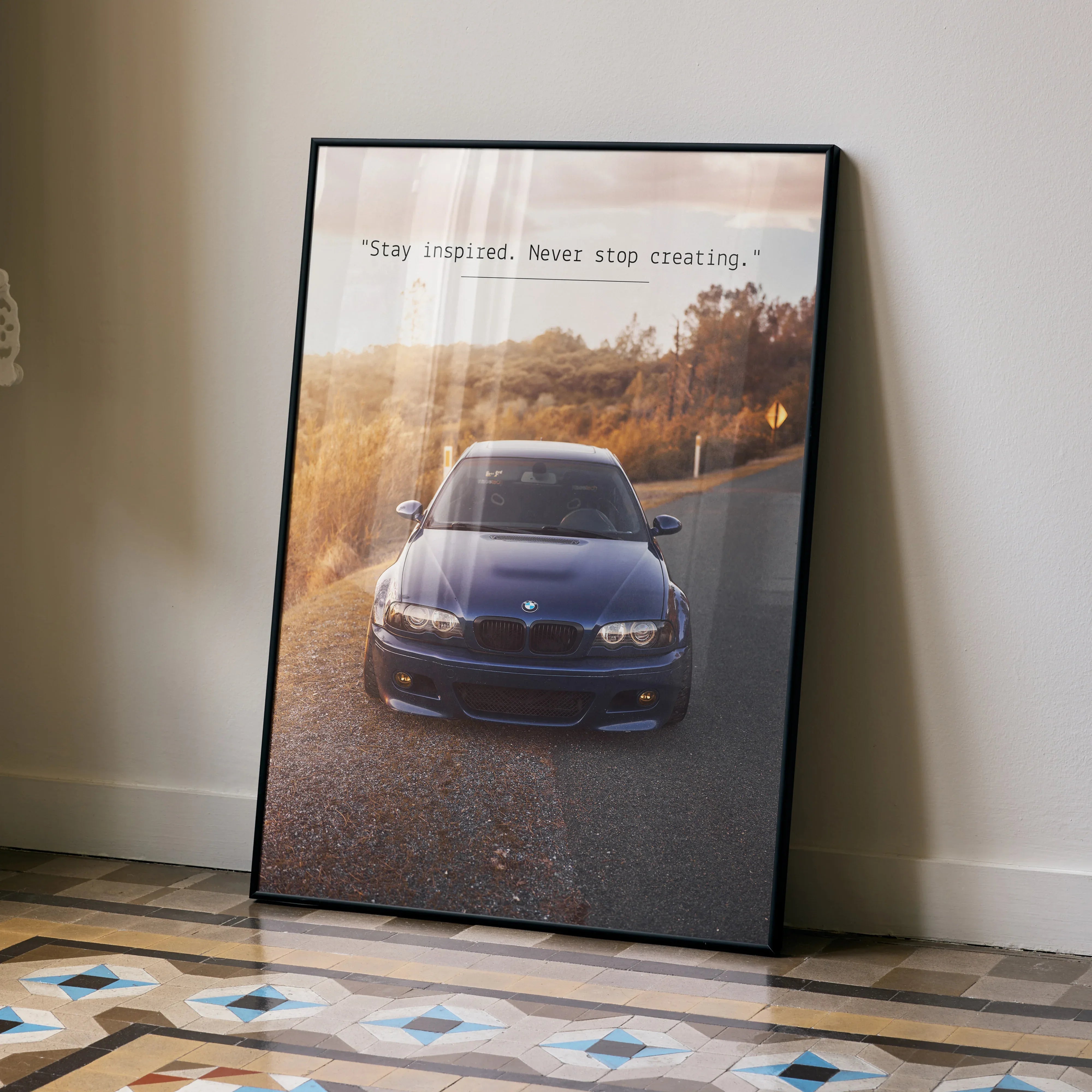 BMW E46 M3 poster wall art with motivational text "Stay inspired. Never stop creating.".