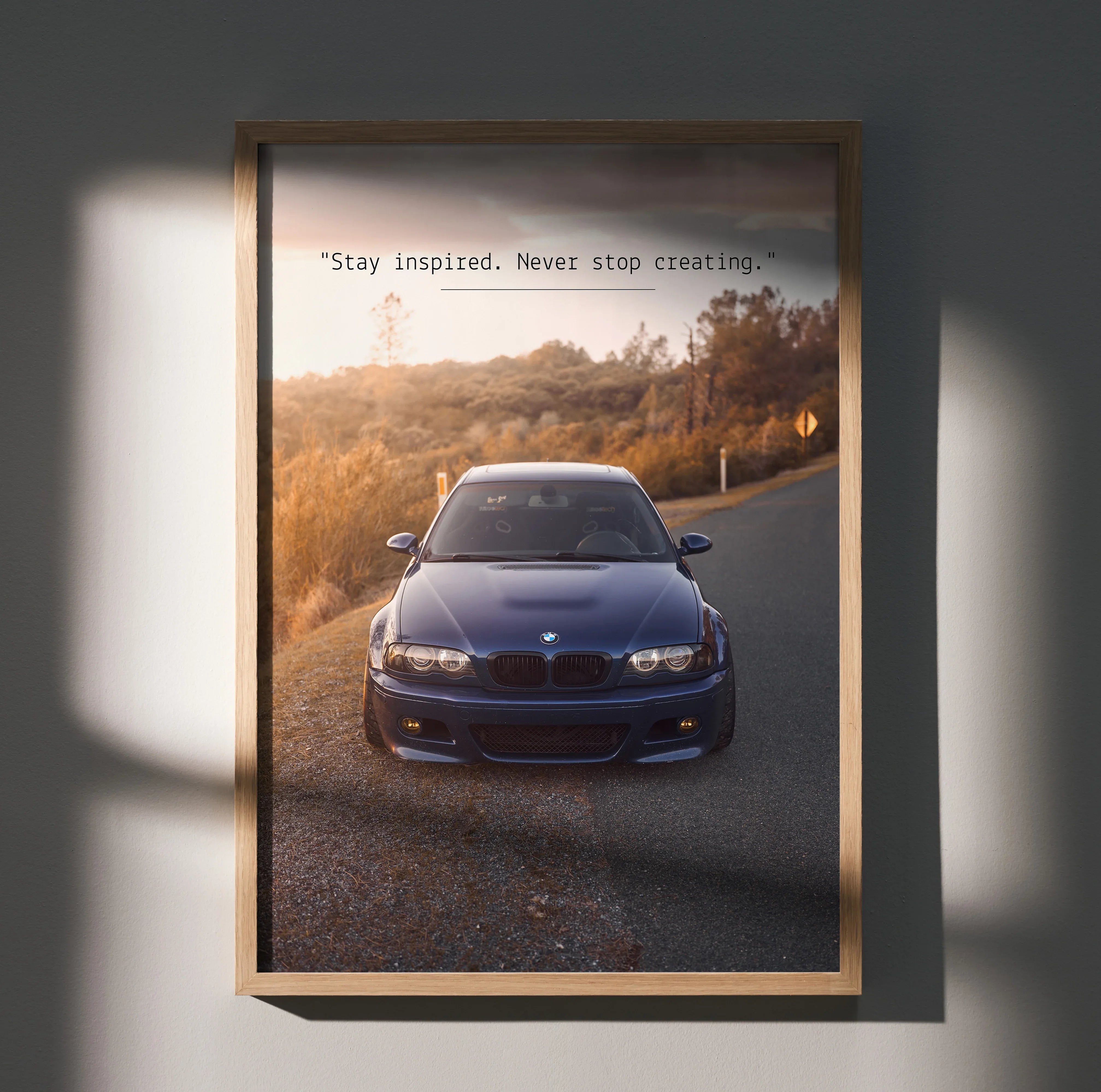 BMW E46 M3 poster wall art featuring the car with inspirational text at sunset.