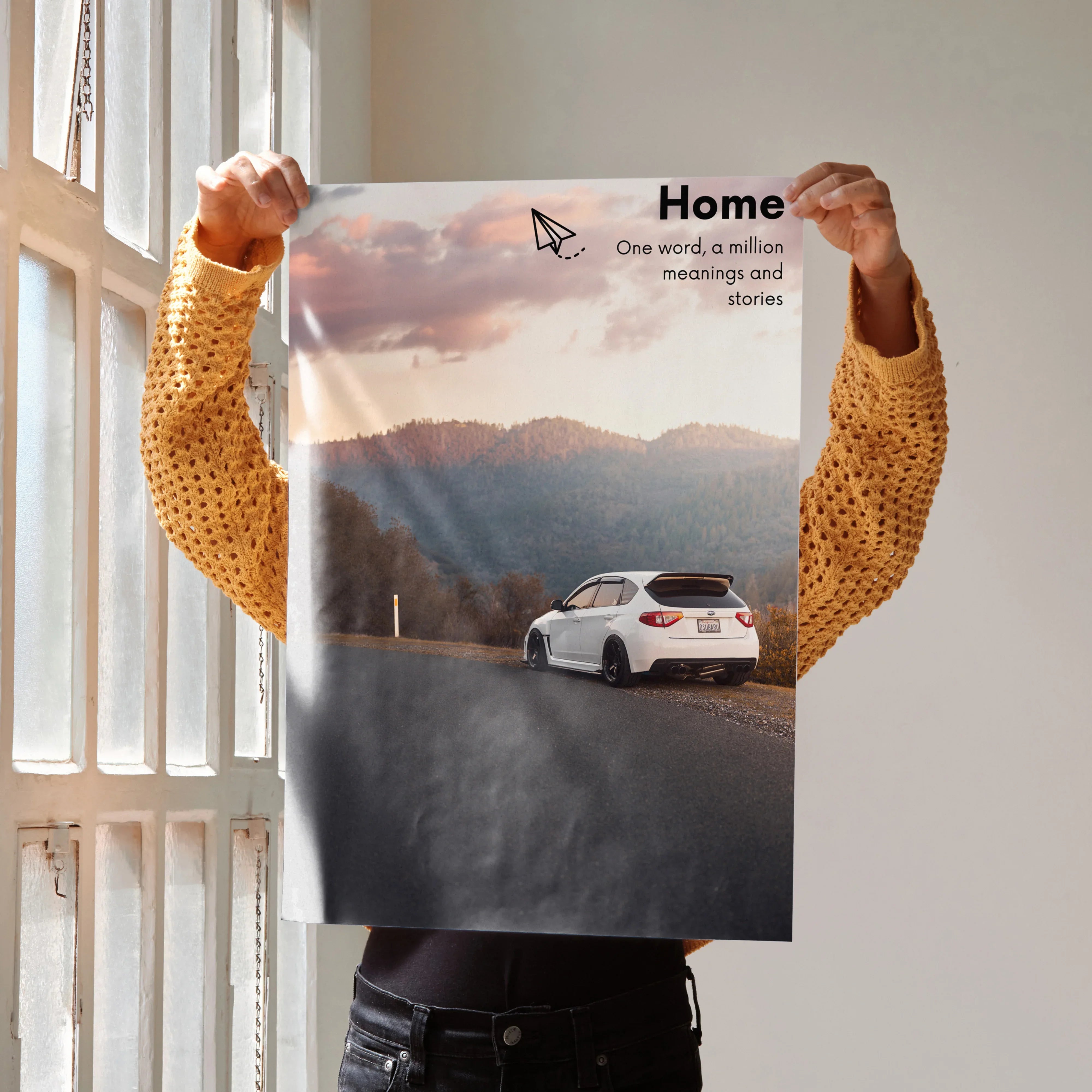 Motivational poster wall art featuring a white Subaru WRX STI driving on a mountain road under a cloudy sky with inspiring.