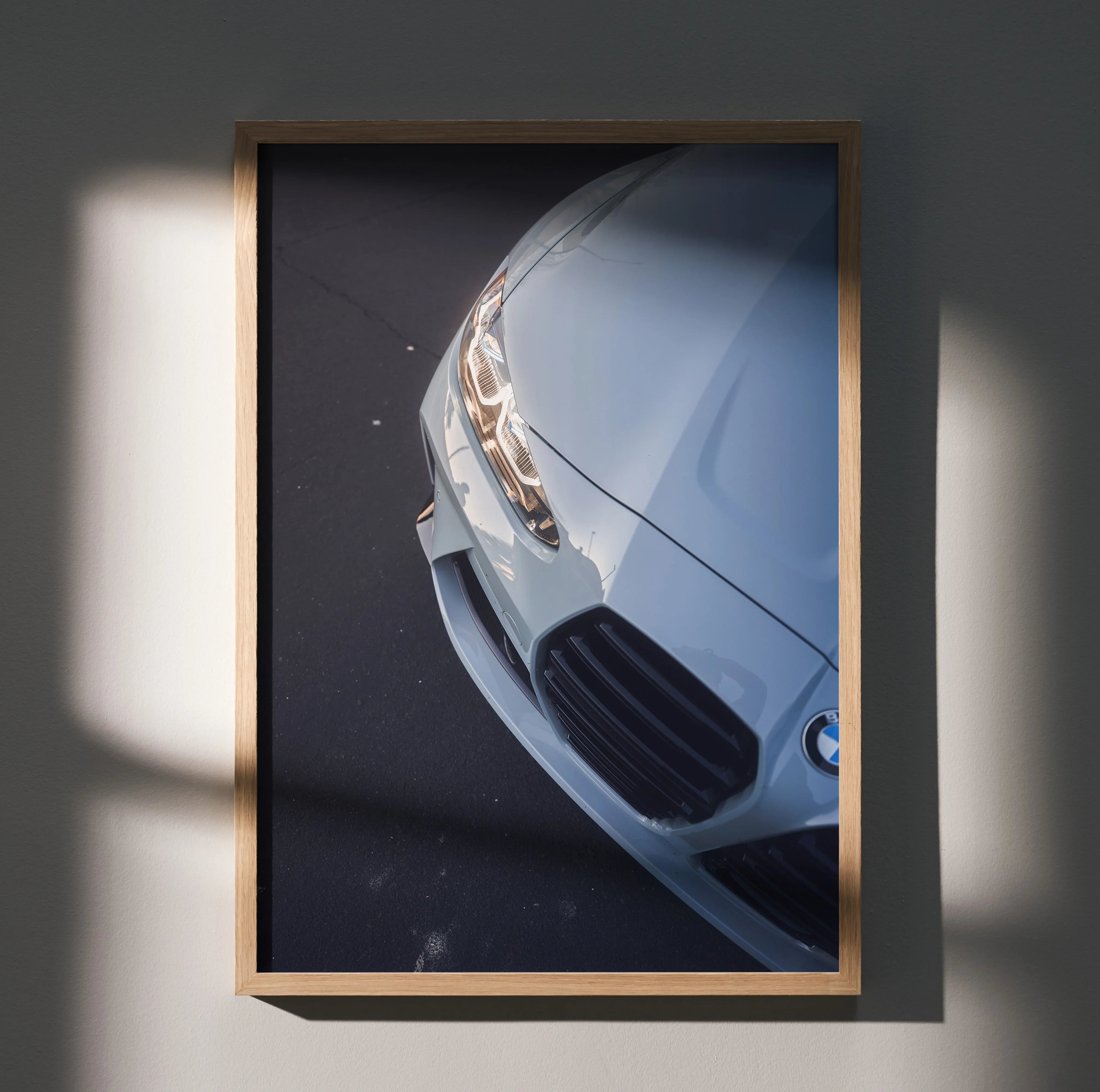 BMW G80 M3 close-up poster showing front headlight and grille, premium automotive wall art.