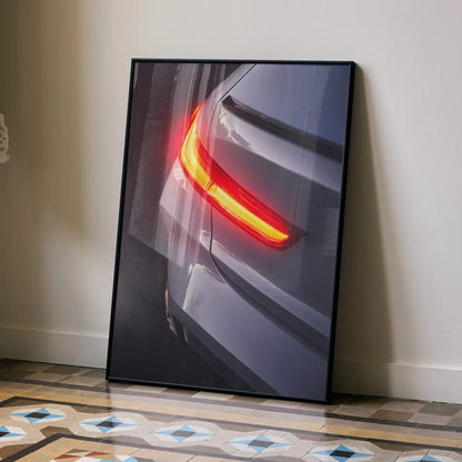 BMW G80 M3 rear close-up poster with glowing red taillight, modern wall art in black frame.